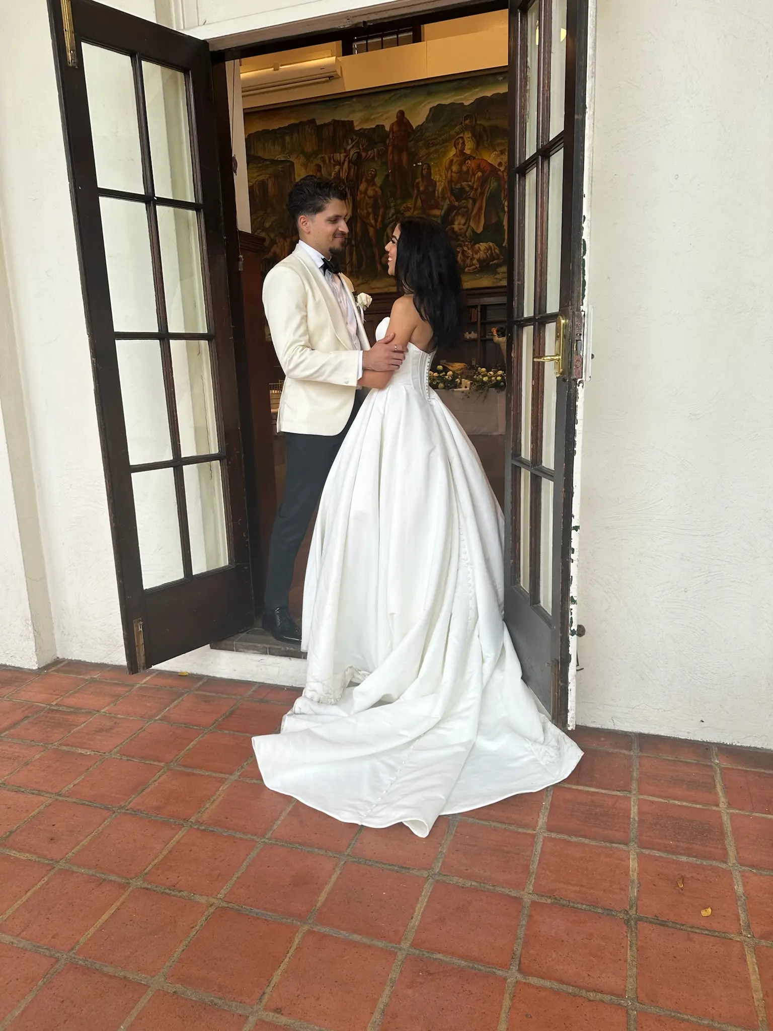 Bride wearing Derrick by Maggie Sottero with her husband