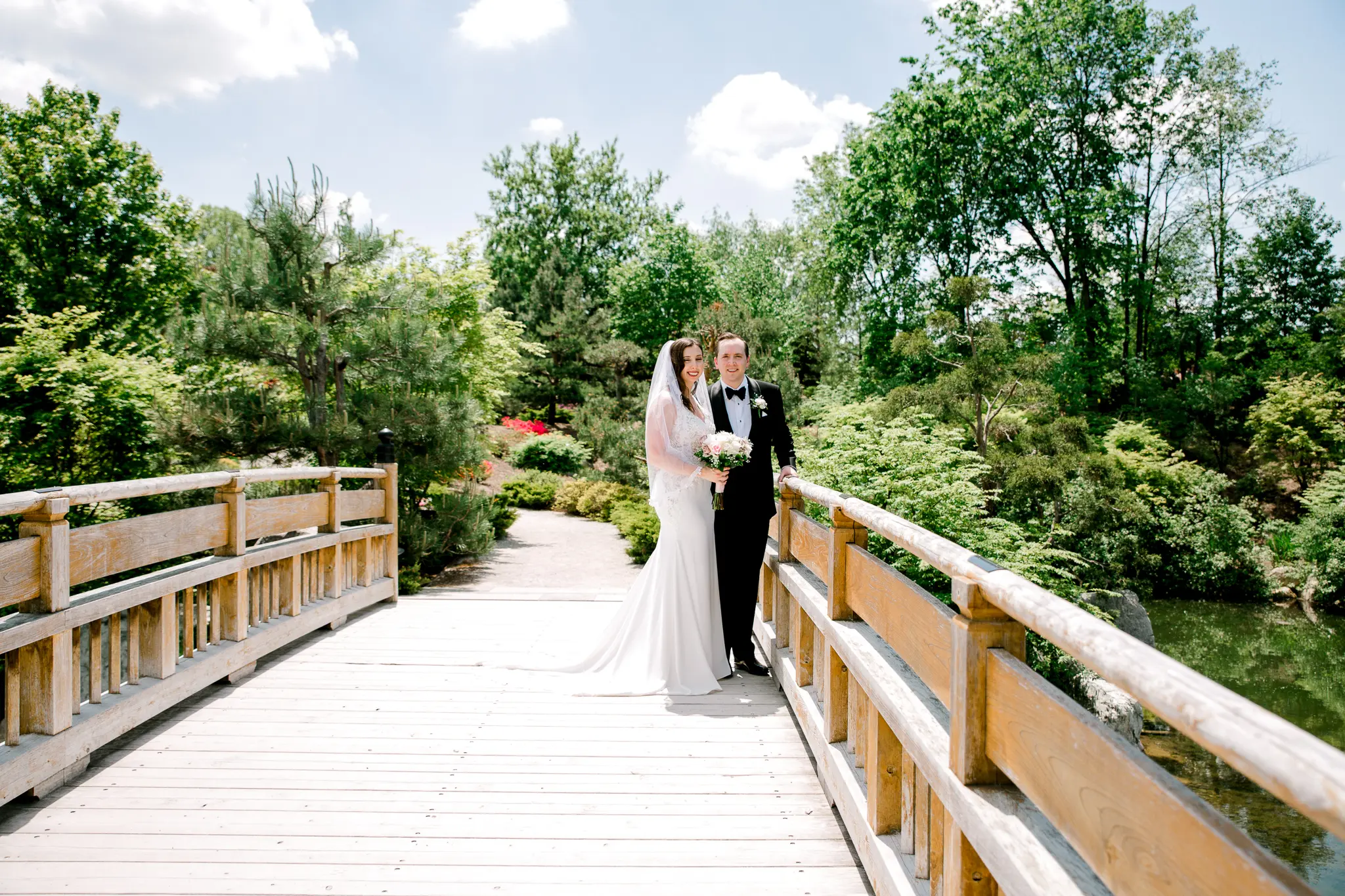 bride with groom in sexy sheath wedding dress