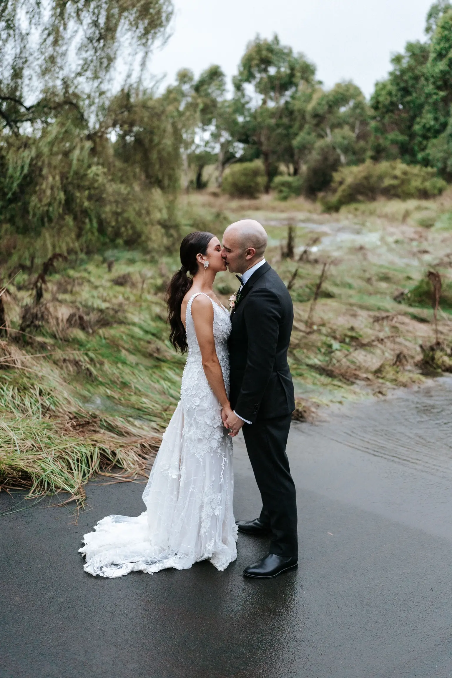 Real Bride wearing puff sleeve wedding dress with 3D floral details called Cruz by Sottero and Midgley..