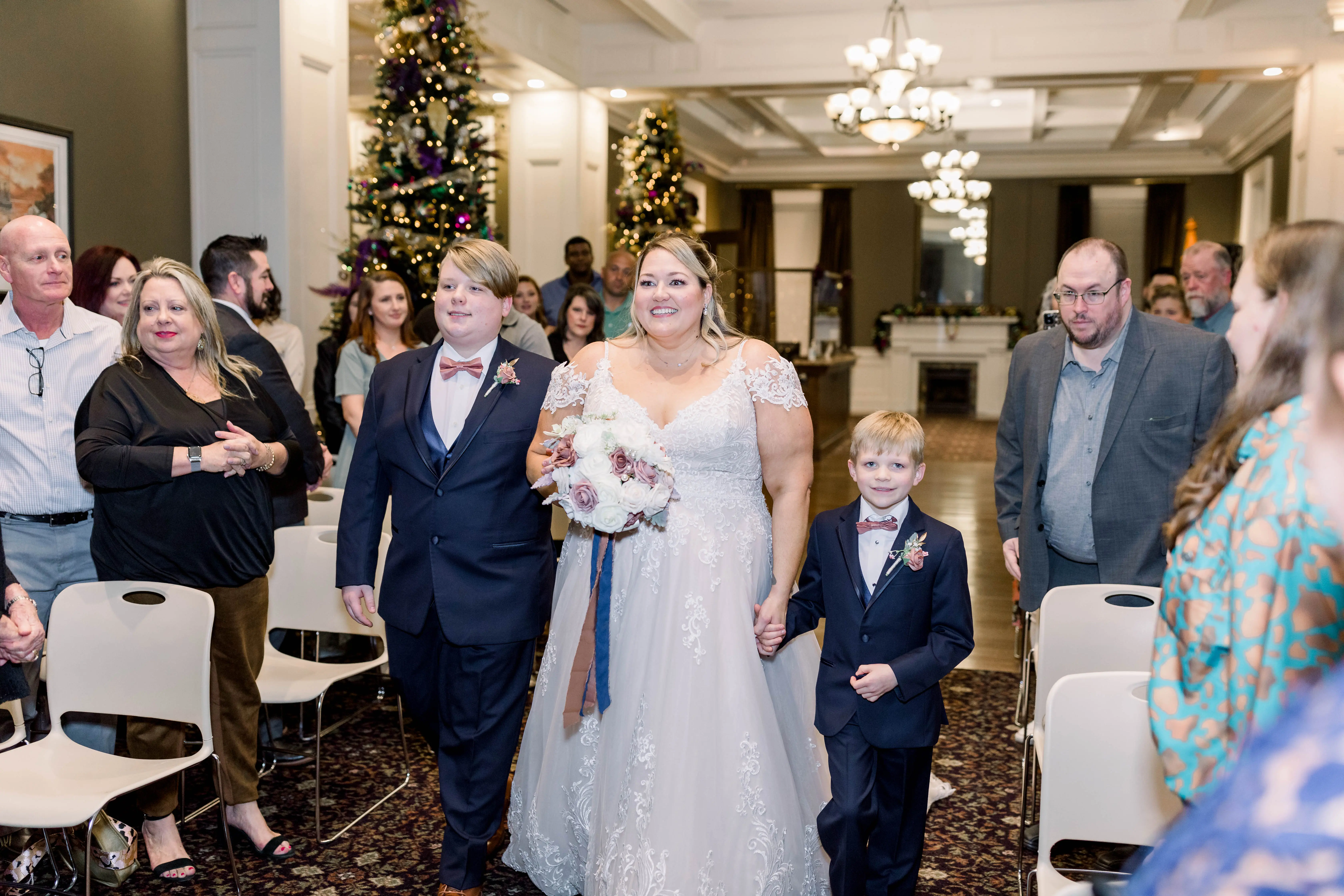 Step Sons Walking Bride Down the Isle, Bride Wearing A-Line Wedding Dress Called Wallis by Maggie Sottero