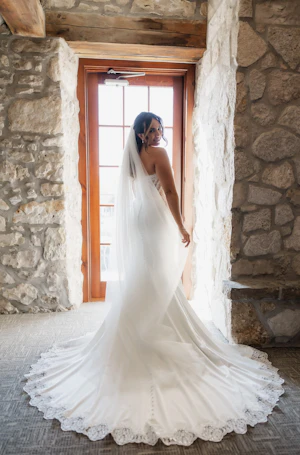 Bride in Opulent Stretch Satin Vintage Sheath Wedding Dress with Scoop Back called Yates by Maggie Sottero