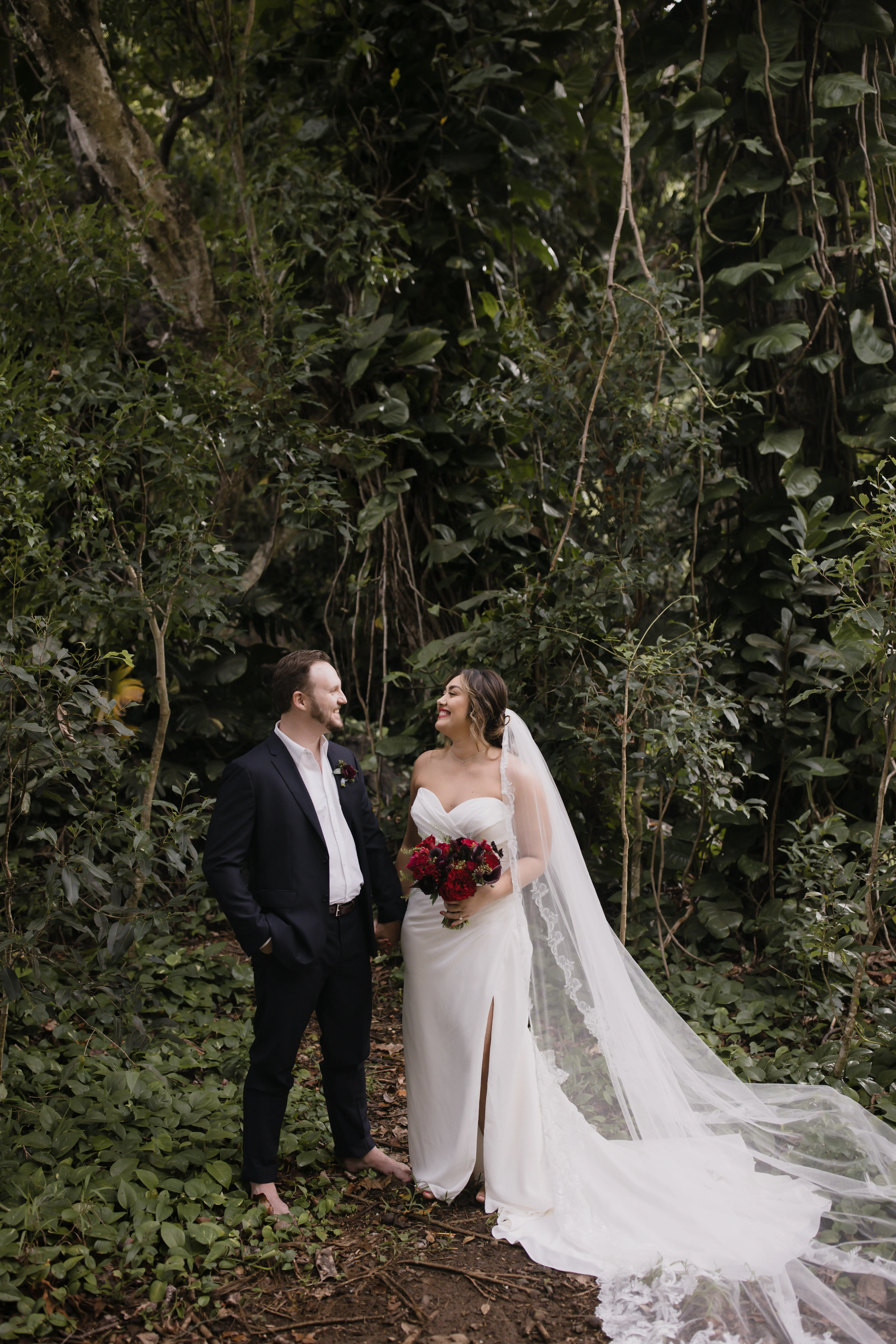 Bride On Beach With Groom In Strapless Wedding Dress Called Monaco By Maggie Sottero