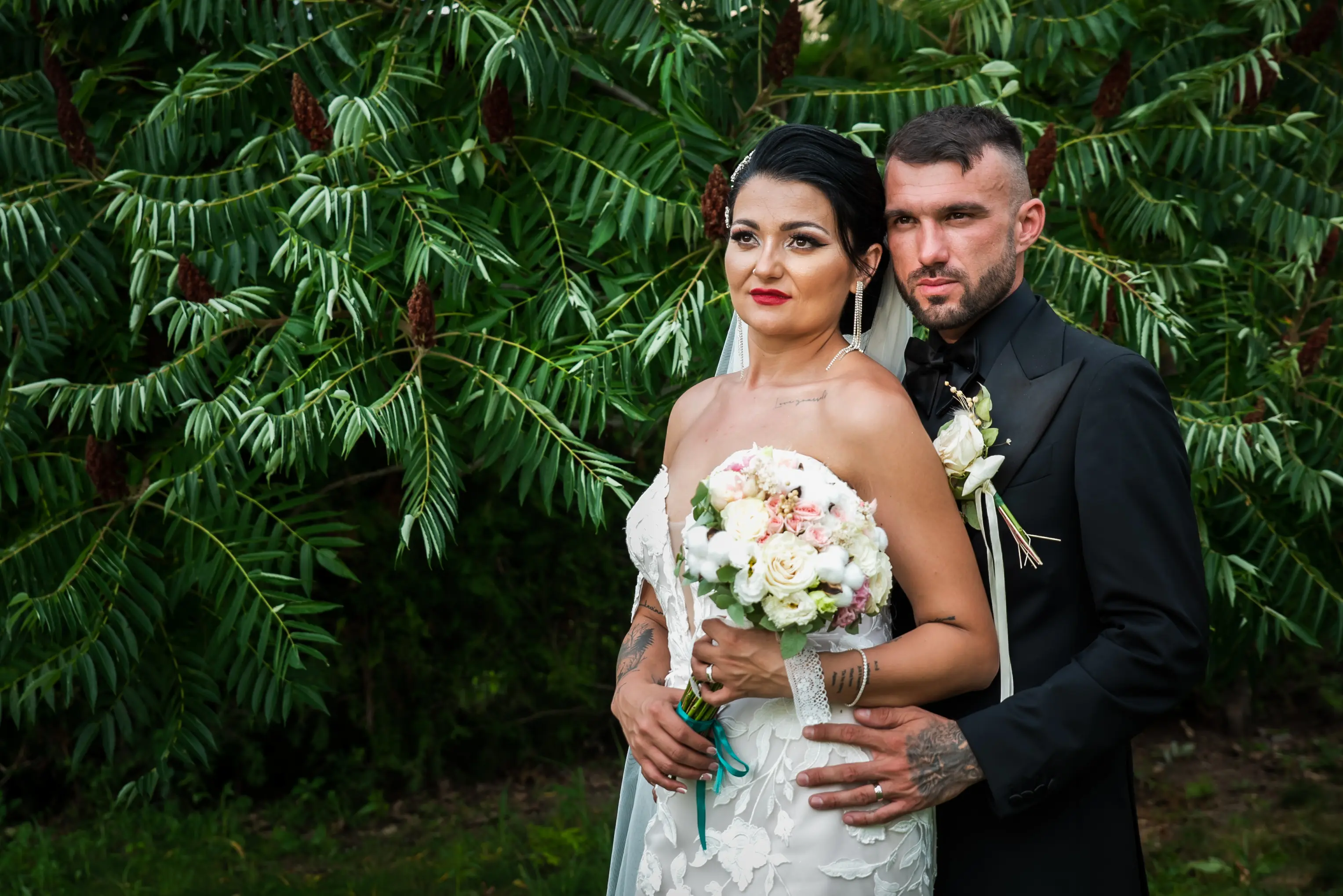 Bride Wearing Lace Mermaid Wedding Gown Called Hattie By Rebecca Ingram With Groom Outside