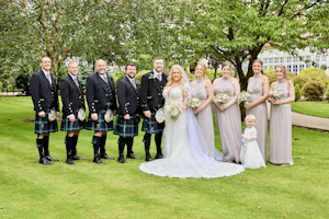 Bride wearing Saige by Maggie Sottero with her wedding party