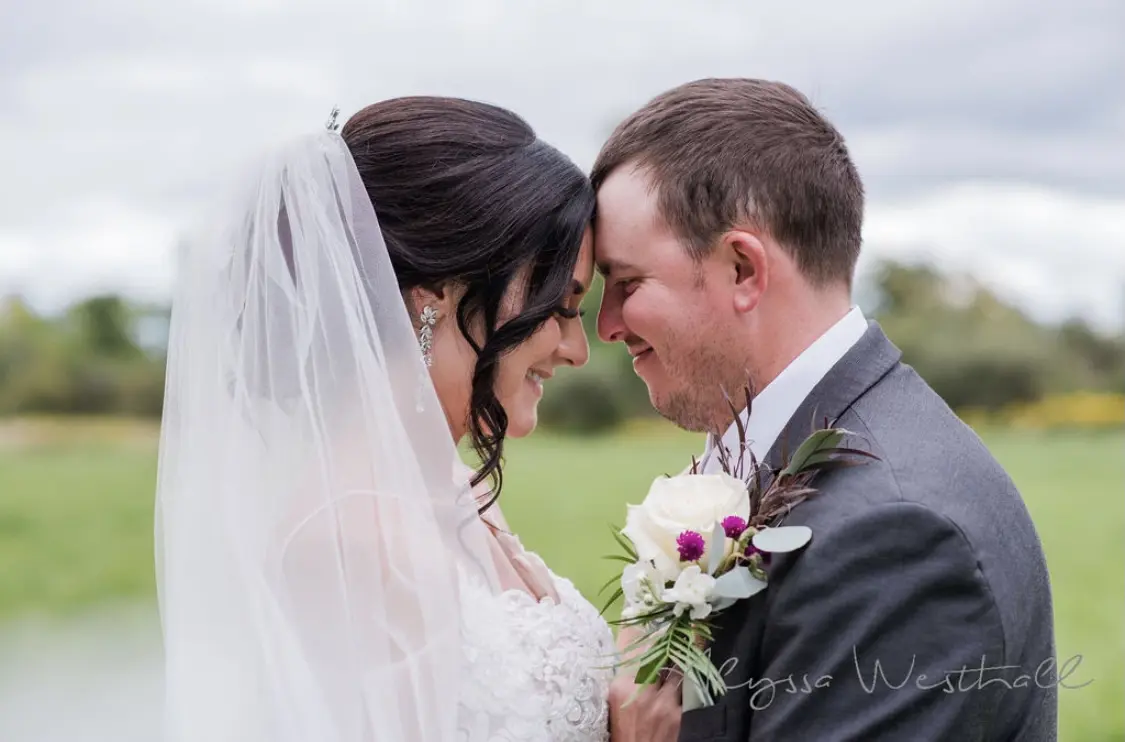 Groom With Bride Wearing Lace Sheath Wedding Dress Tuscany Lynette By Maggie Sottero