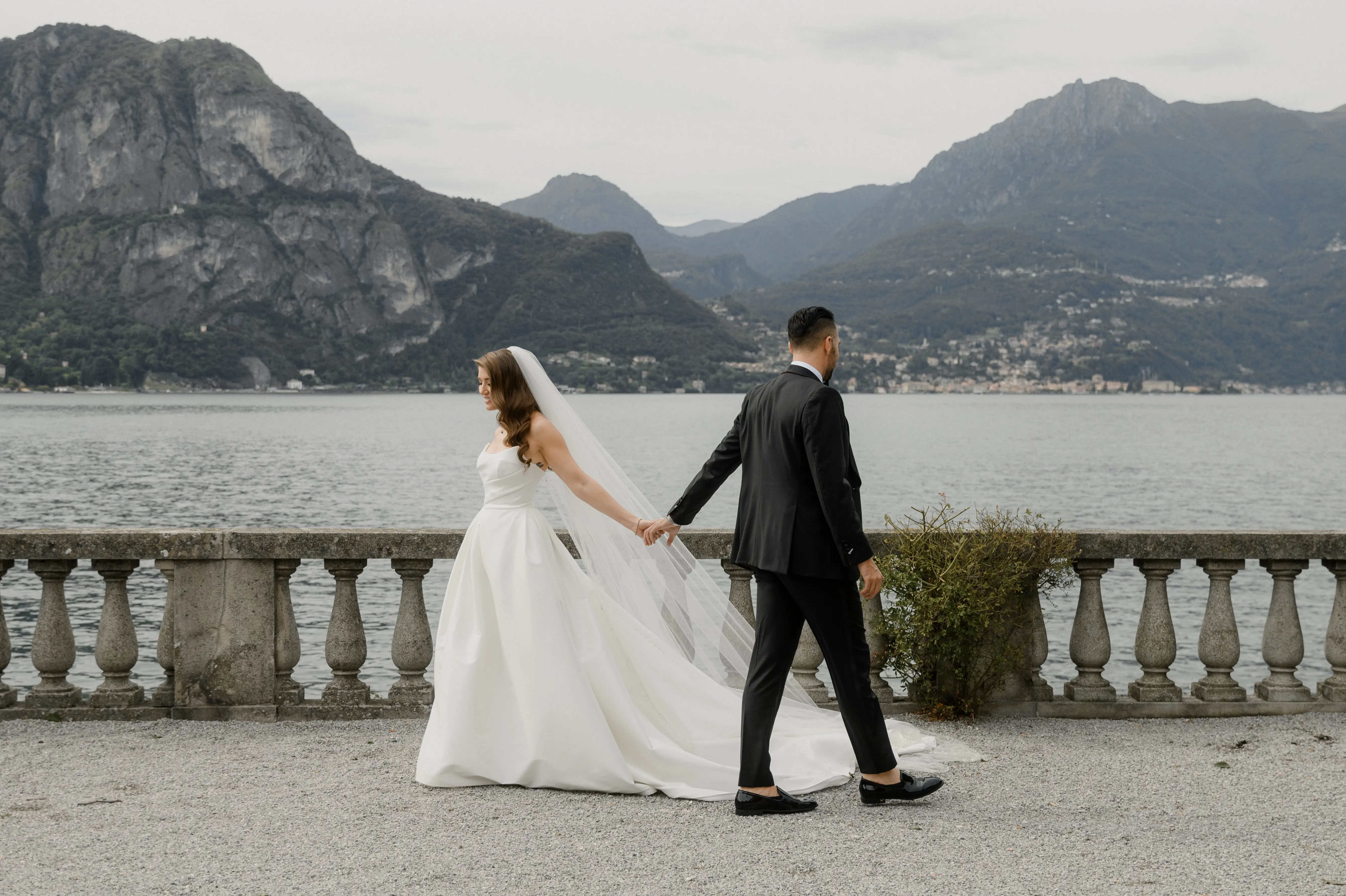 Bride wearing Aspen by Sottero and Midgley holding hands with her husband