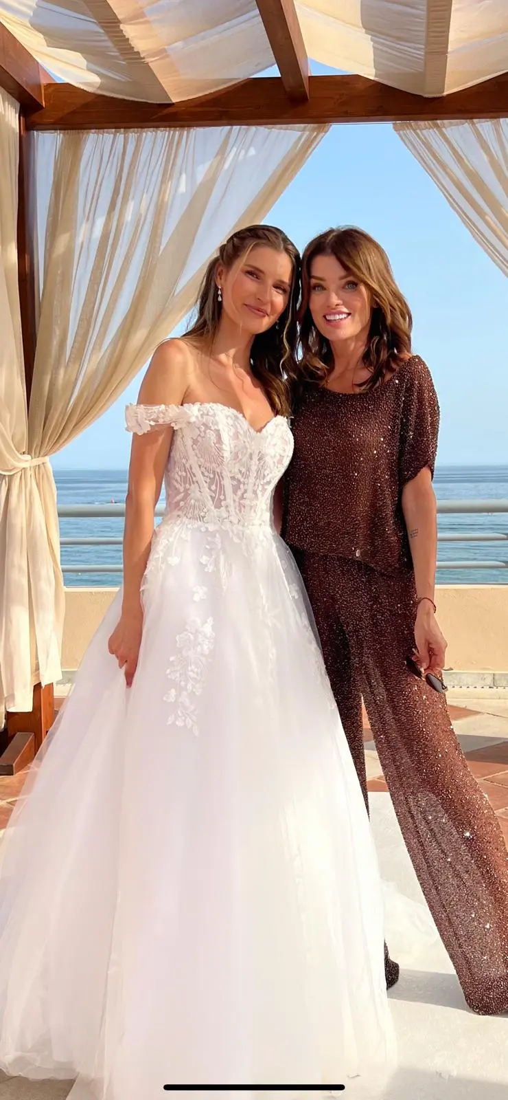 Bride Posing In Off The Shoulder Floral Wedding Dress Named Harlem By Maggie Sottero