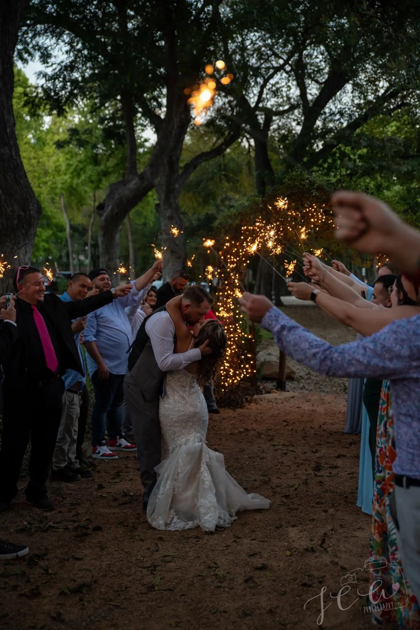 Groom Kissing Bride in Vintage-Inspired Fitted Wedding Dress with Glitter called Veronique by Maggie Sottero
