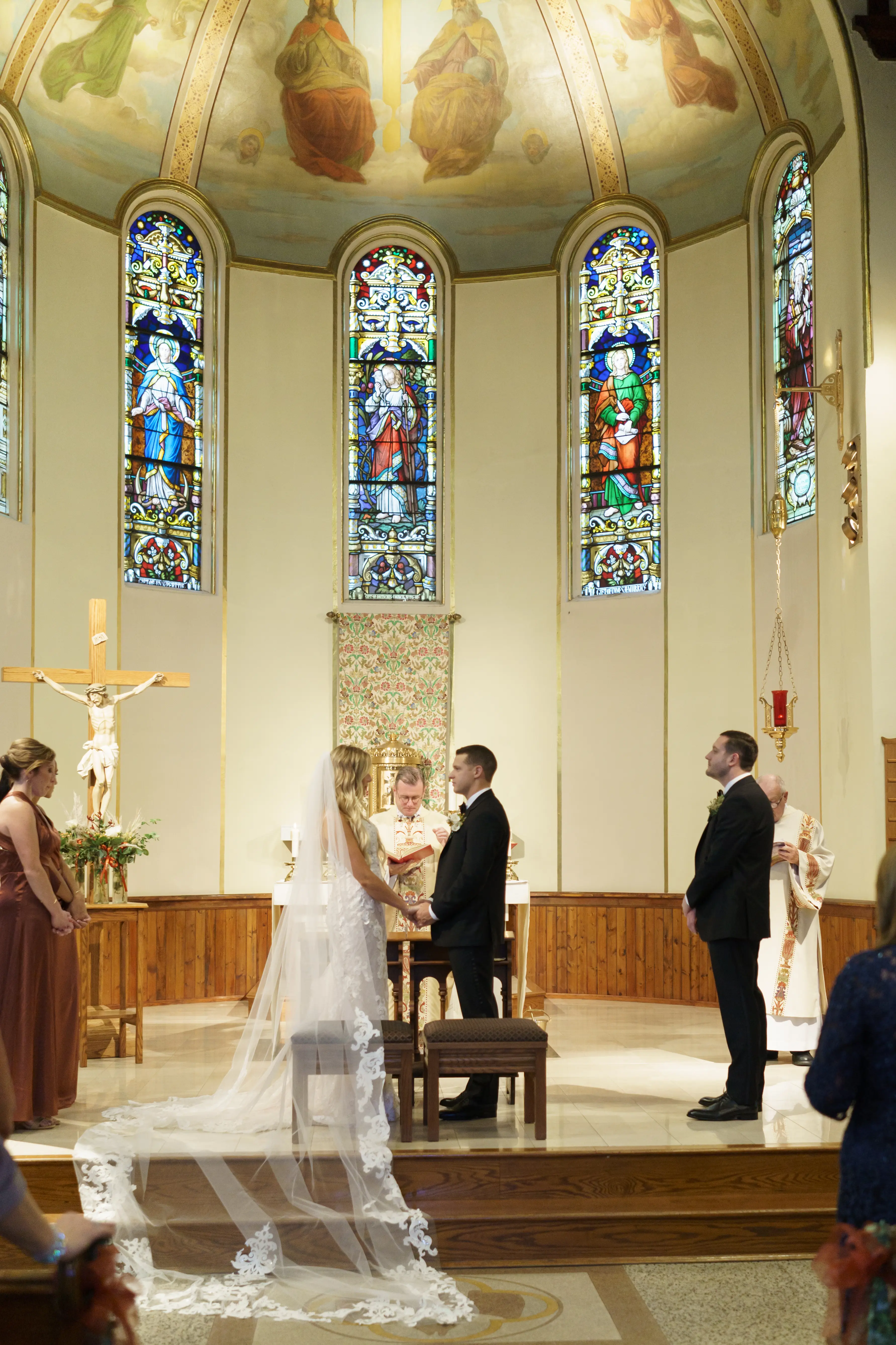 Bride wearing Lace Sheath Wedding Dress called Tuscany Lynette by Maggie Sottero and Groom at the altar