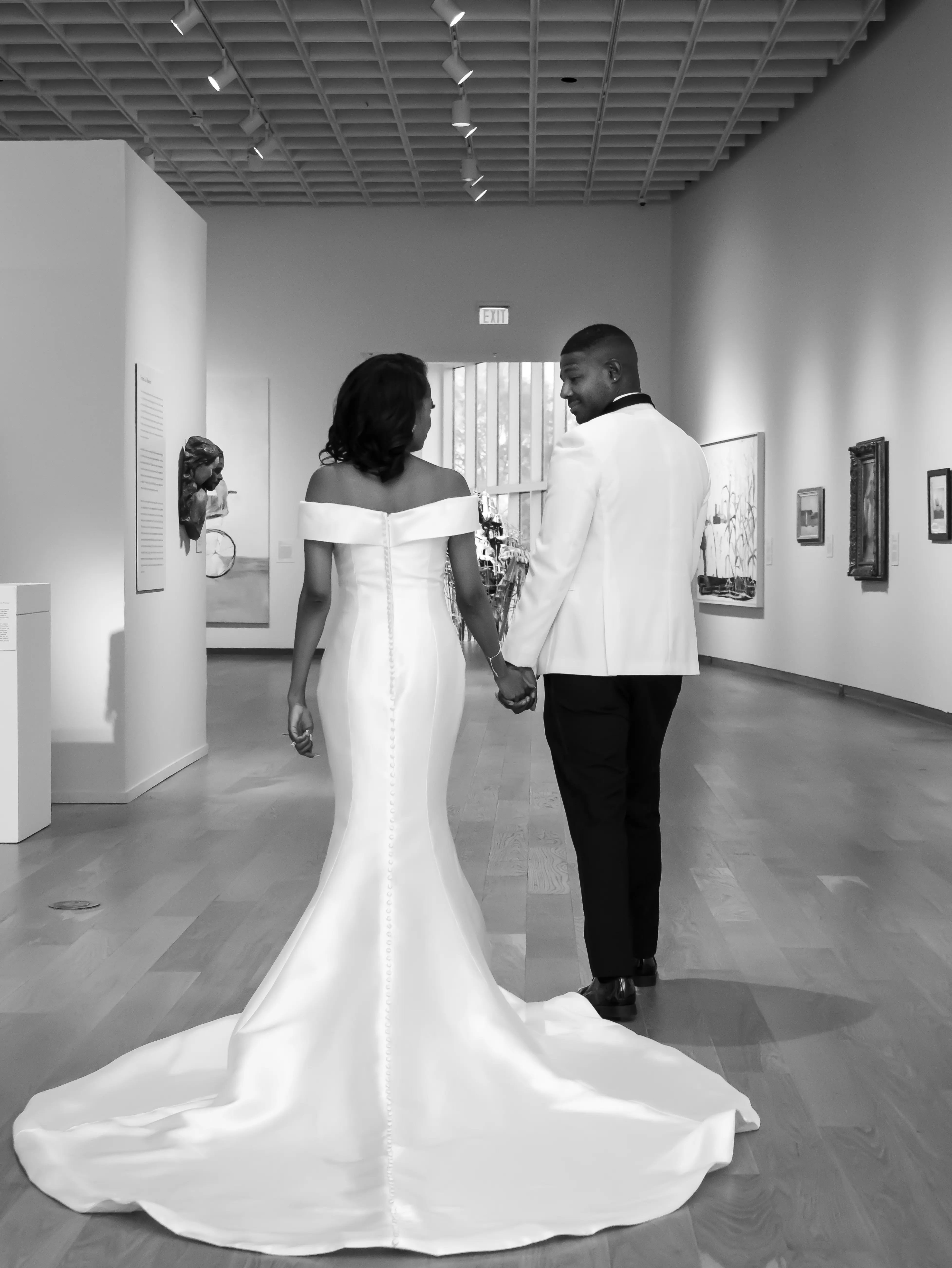 Bride Wearing Simple Mermaid Wedding Dress Called Josie By Rebecca Ingram Holding Hands With Groom