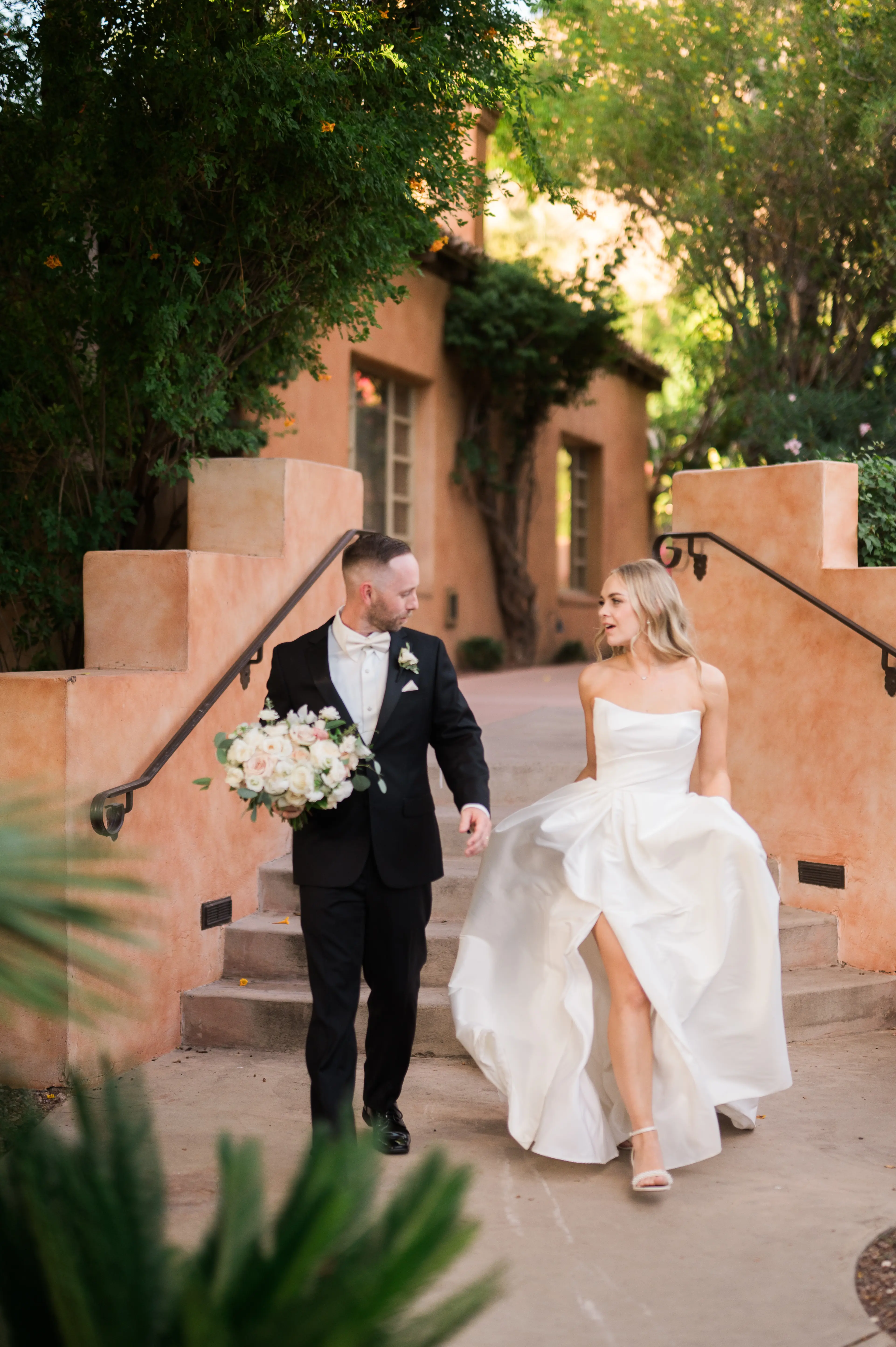 Bride wearing Aspen wedding dress by Sottero and Midgley with groom