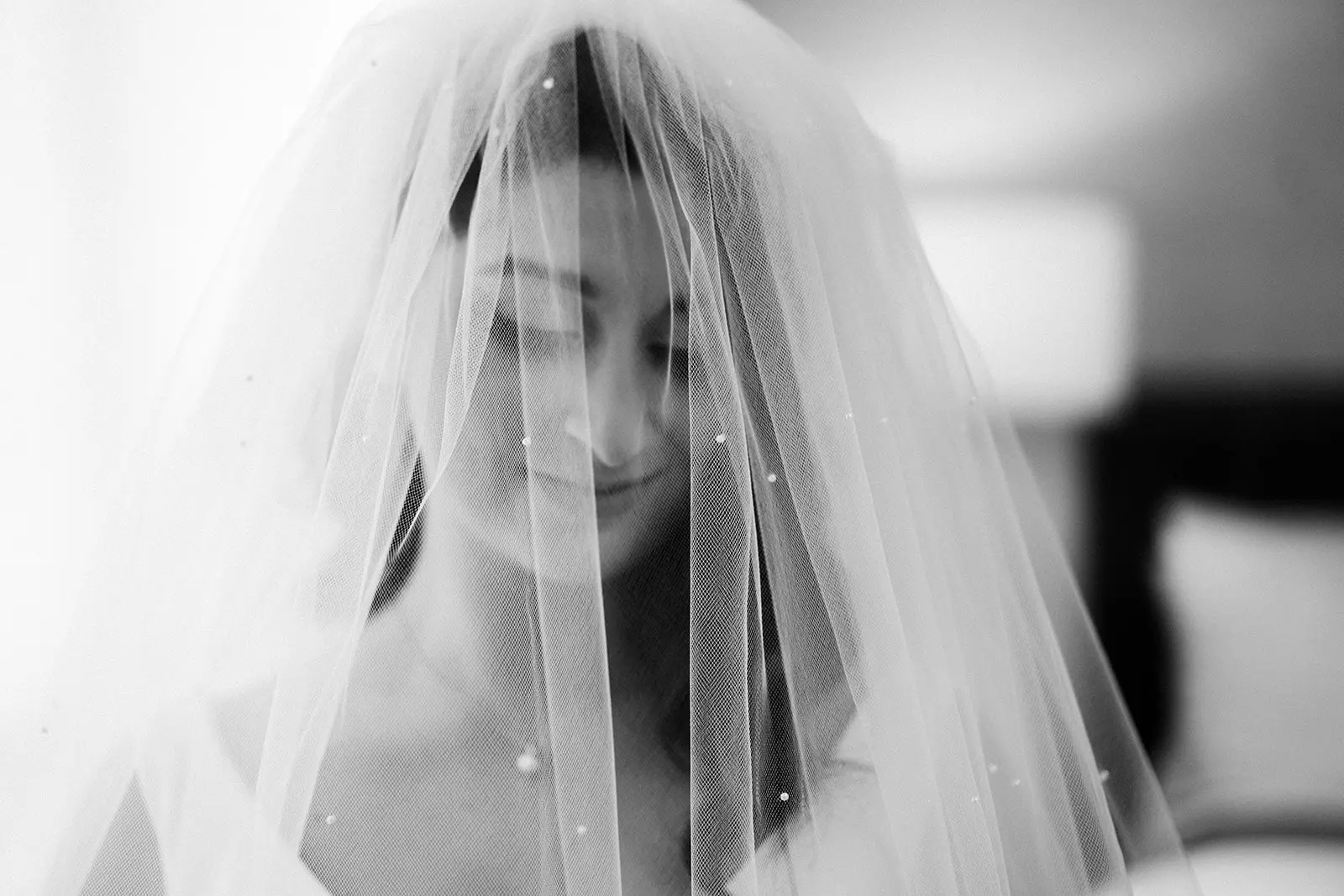 Bride Wearing Simple Wedding Dress Called Theodora By Rebecca Ingram With A Pearl Accented Veil
