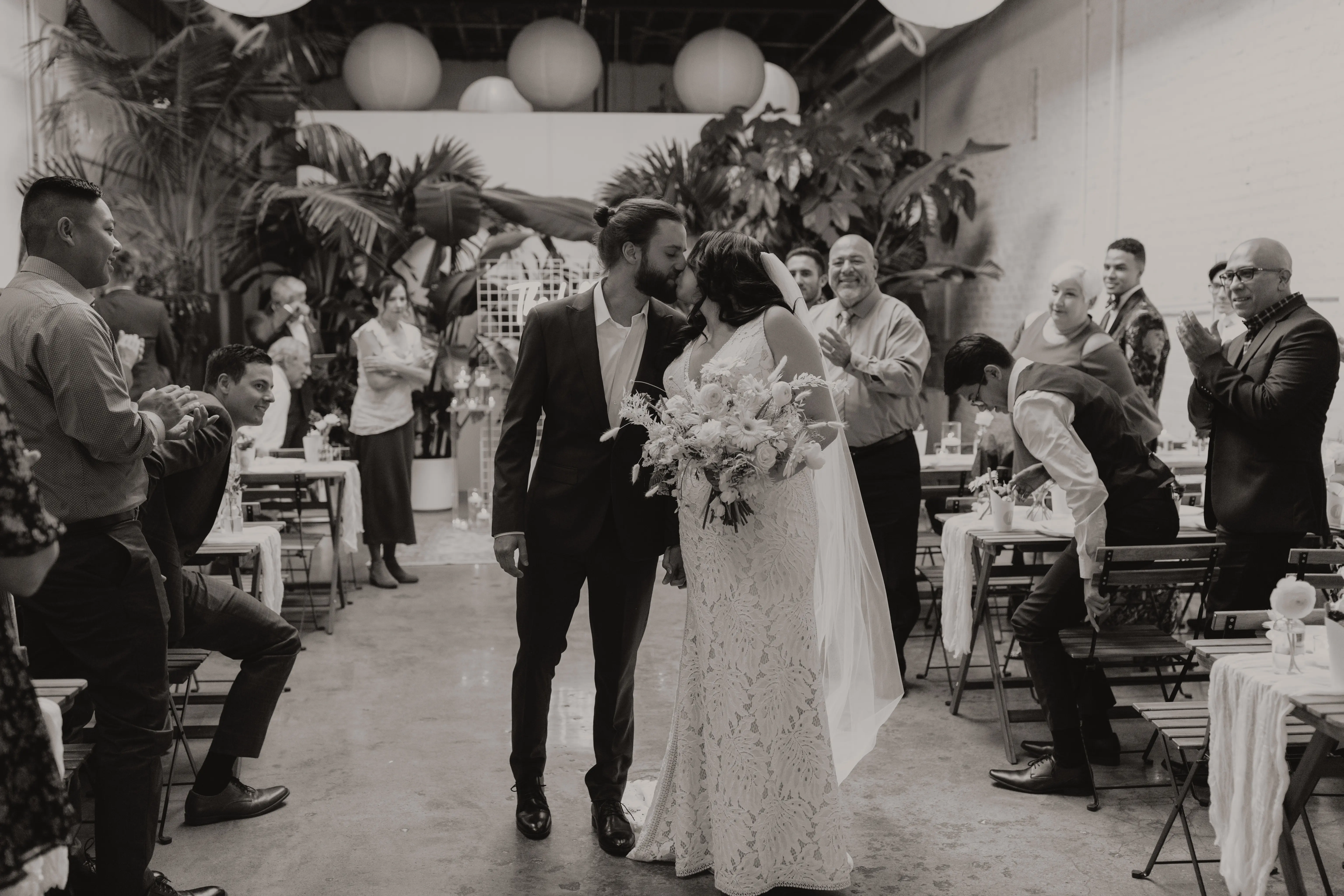 Bride and groom kissing after saying their I do's.