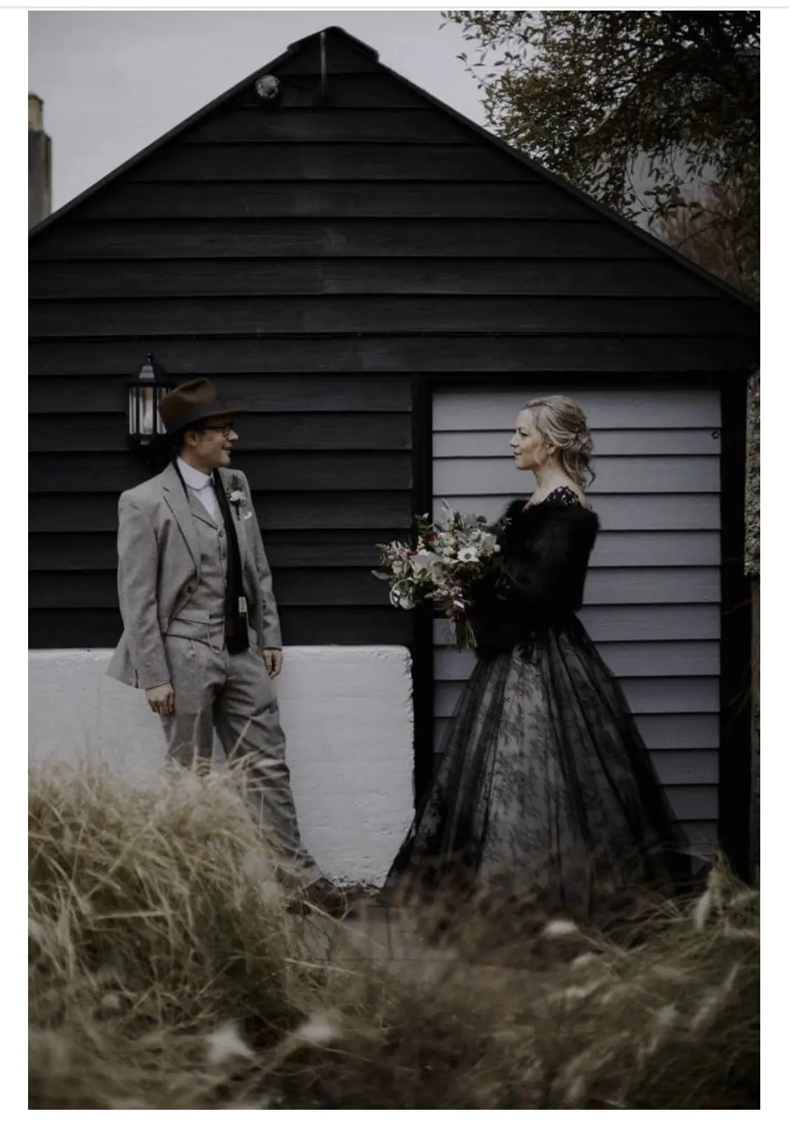 Bride Wearing Black Ballgown Wedding Gown Called Zander By Sottero and Midgley With Groom