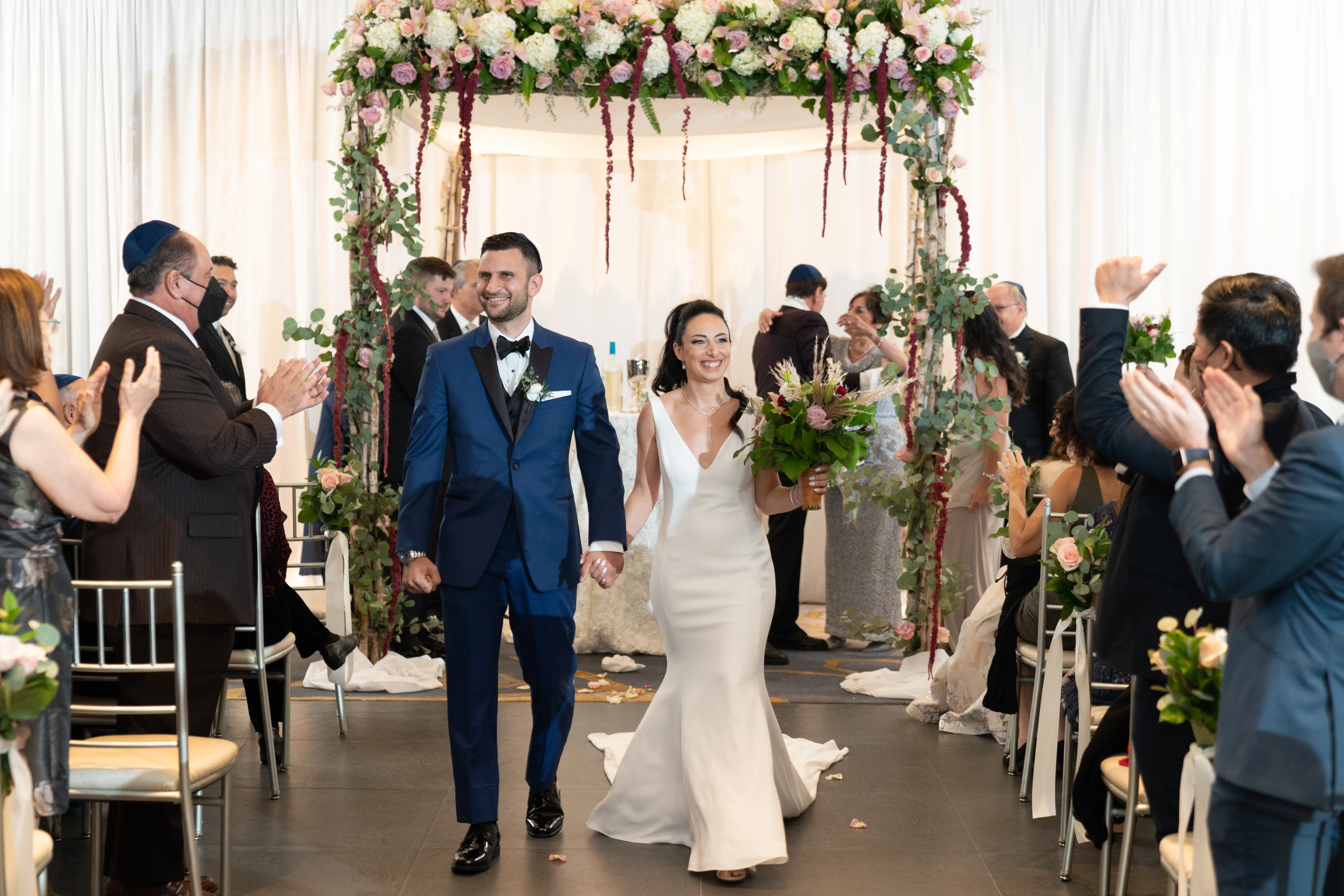 Bride with groom wearing simple fit and flare crepe wedding dress