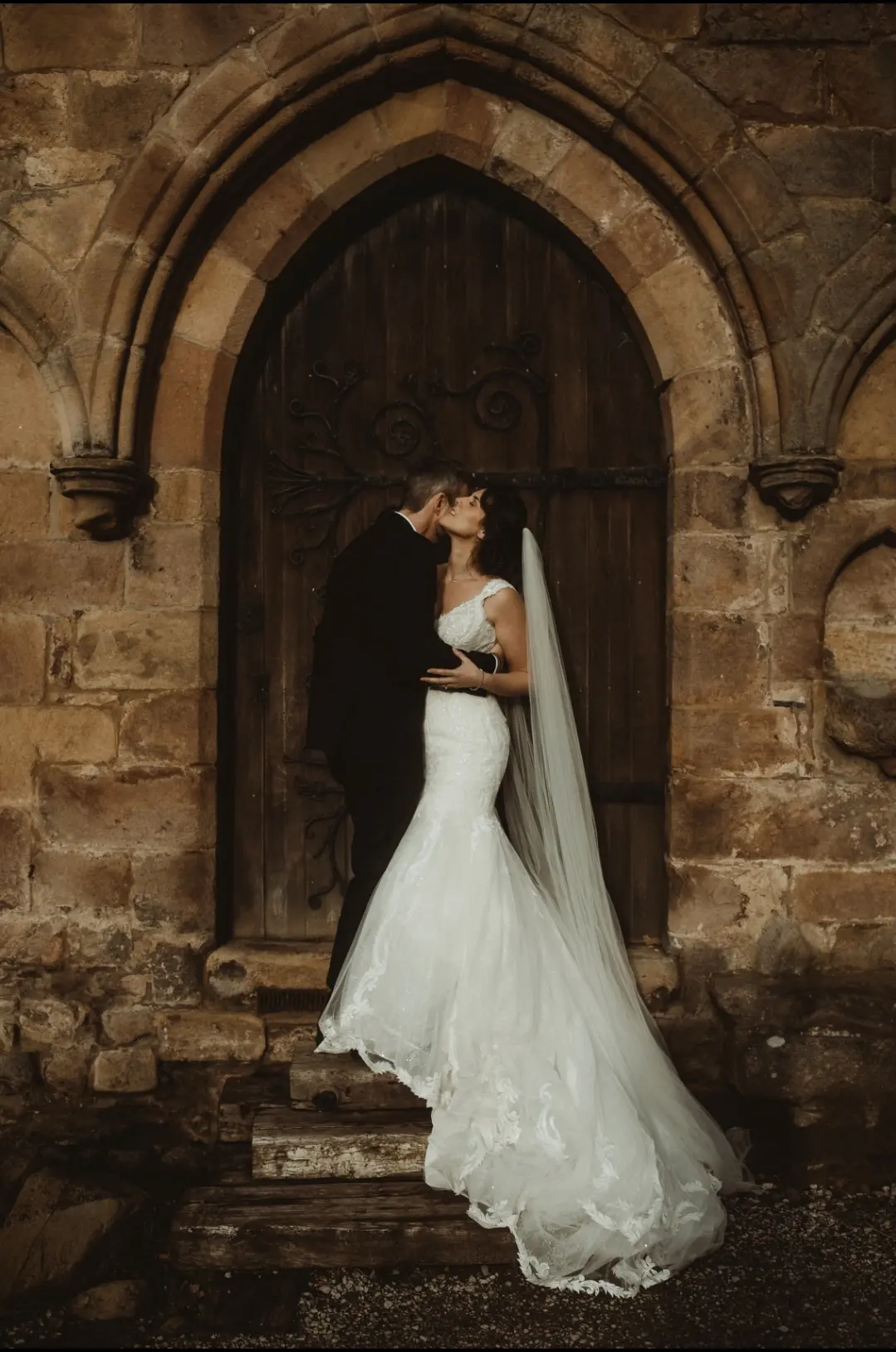 Real Bride in V-Neckline Mermaid Wedding Dress Named Joss by Sottero & Midgley with Groom