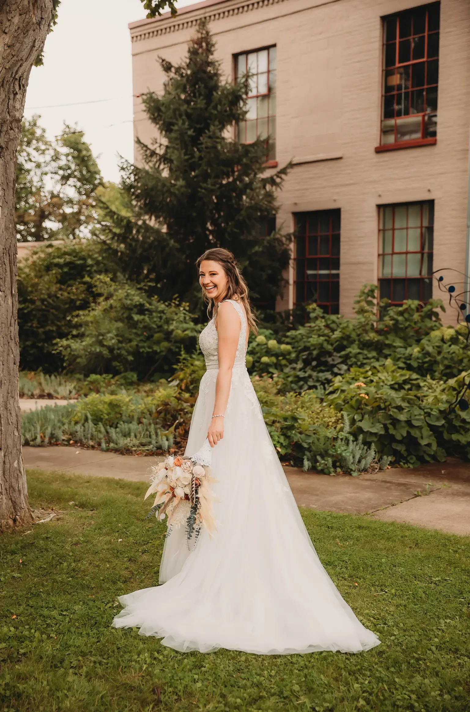 Real Bride in A-Line Wedding Dress with Flowy Tulle Skirt and Sheer Lace Bodice Called Ohara by Maggie Sottero