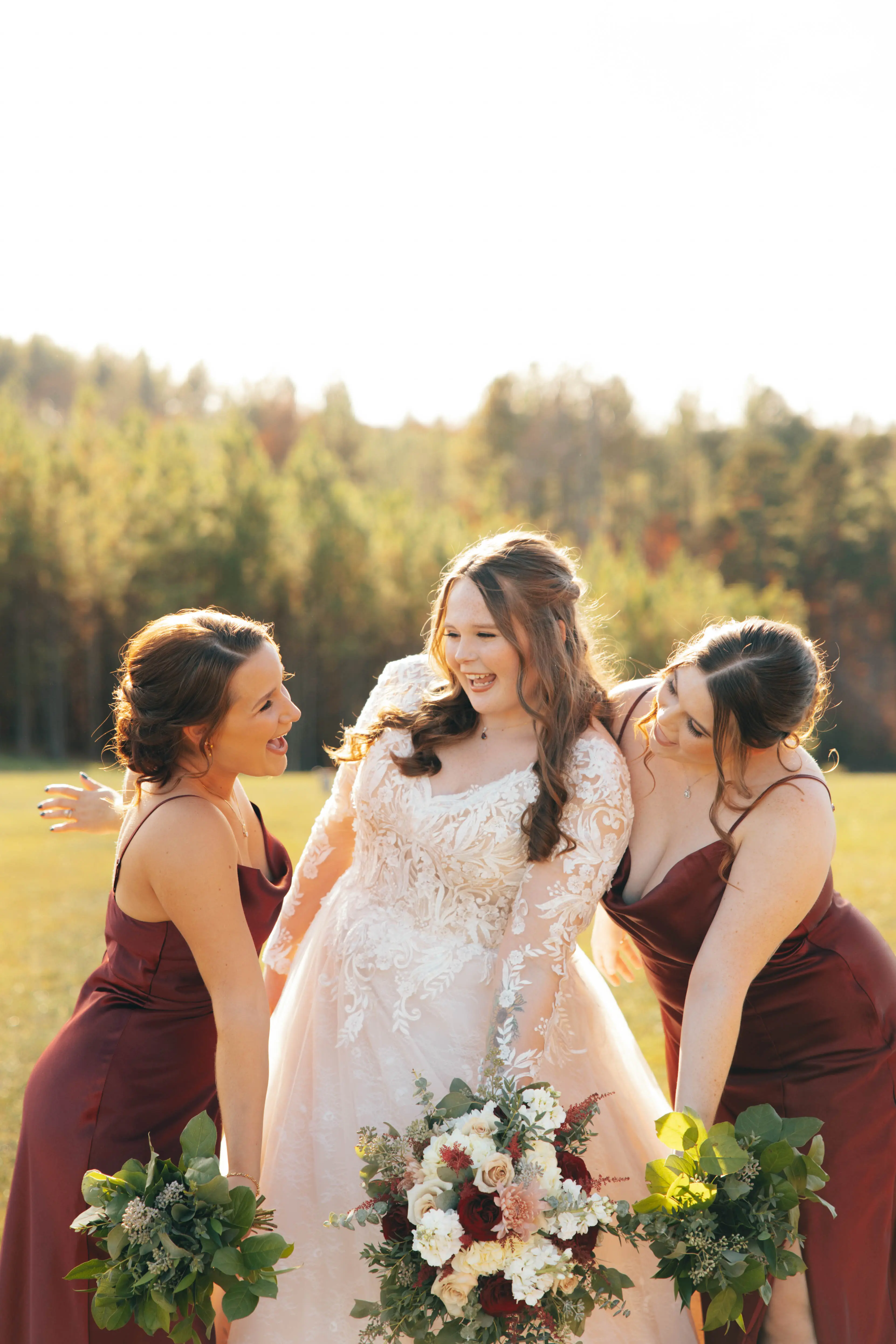 Bride wearing Zander wedding gown by Sottero and Midgley with her bridesmaids