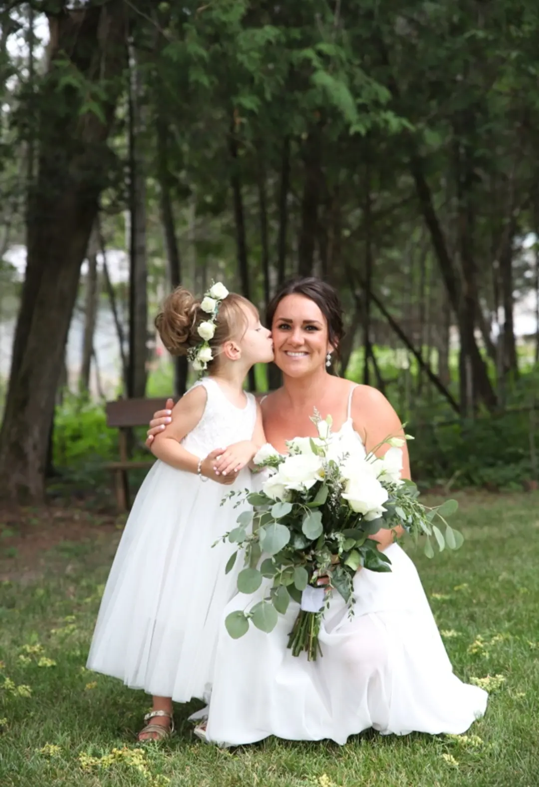 Bride Wearing Simple Chiffon Wedding Dress Called Marta Lynette By Rebecca Ingram Kissed By Flower Girl Daughter
