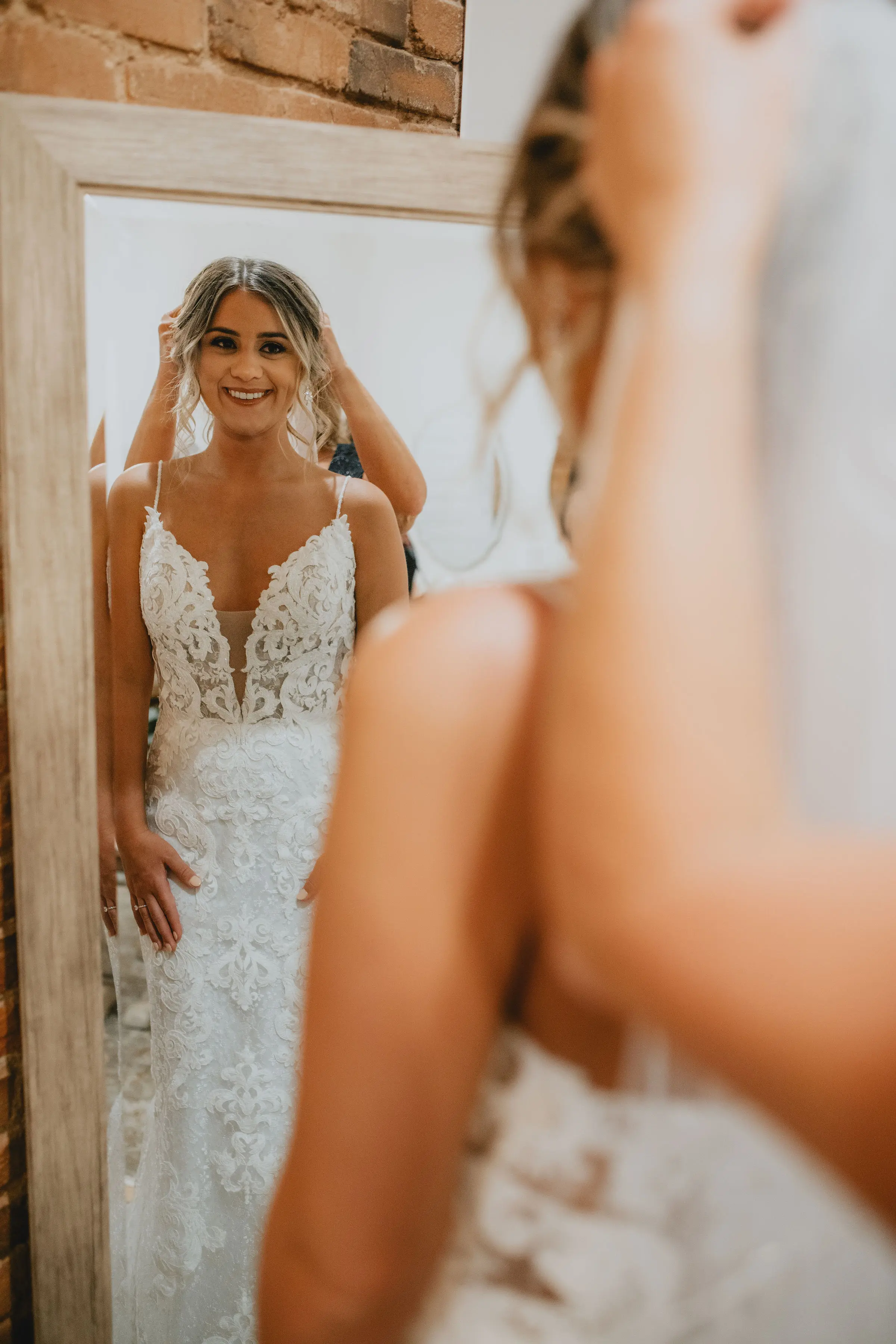 Bride in romantic lace sheath wedding dress