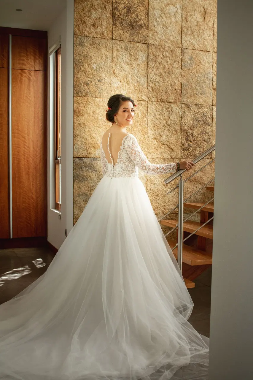 Bride in Long Sleeve Ball Gown Wedding Dress Named Mallory Dawn by Maggie Sottero