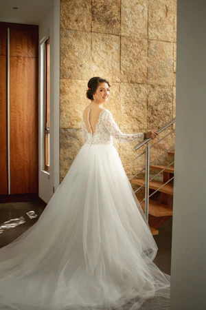 Bride in Long Sleeve Ball Gown Wedding Dress Named Mallory Dawn by Maggie Sottero