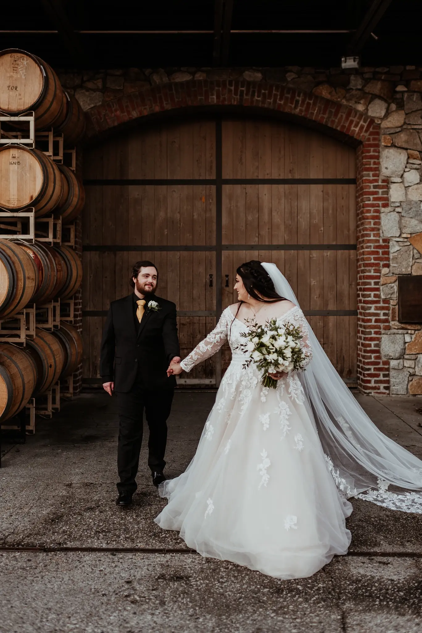 Real Bride wearing long sleeve A-Line wedding dress called Raphael by Maggie Sottero.