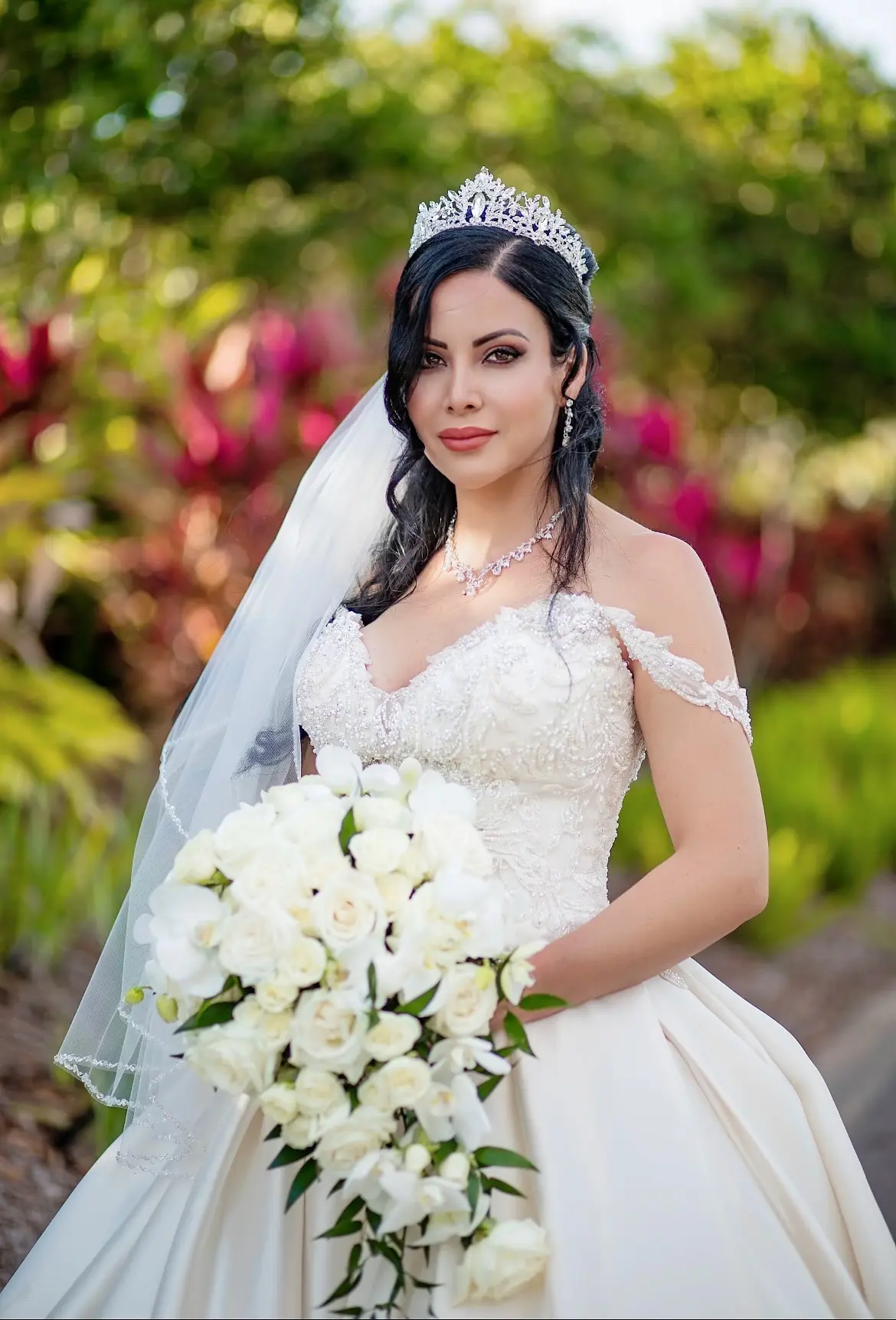 Bride wearing elegant satin ballgown called Kimora by Sottero and Midgley