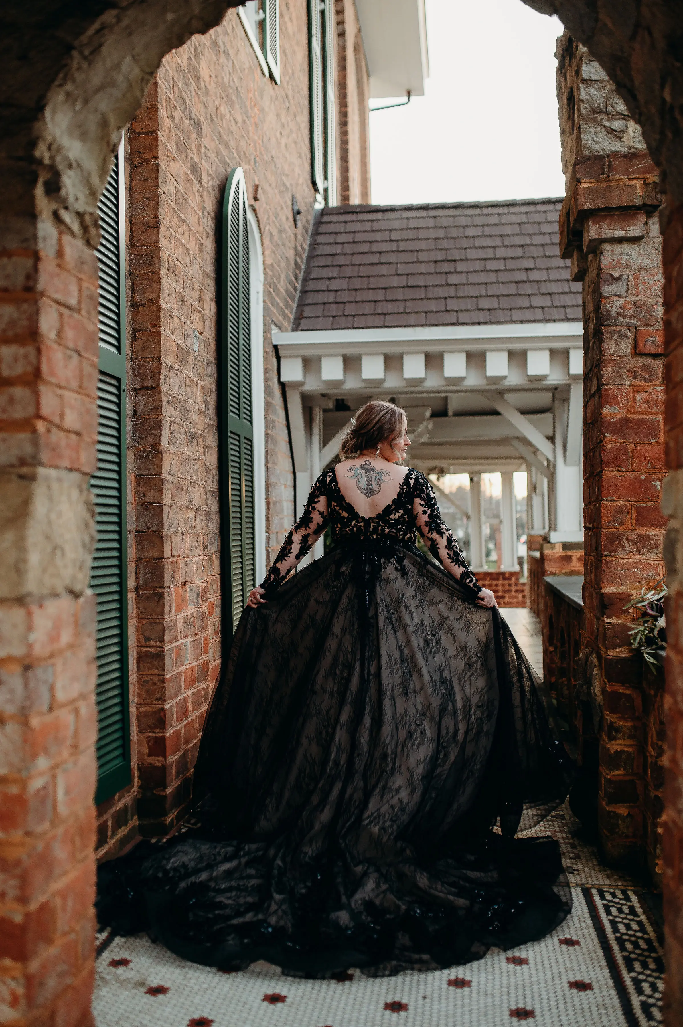 Bride In Long Sleeve Black Wedding Dress Called Zander By Sottero And Midgley