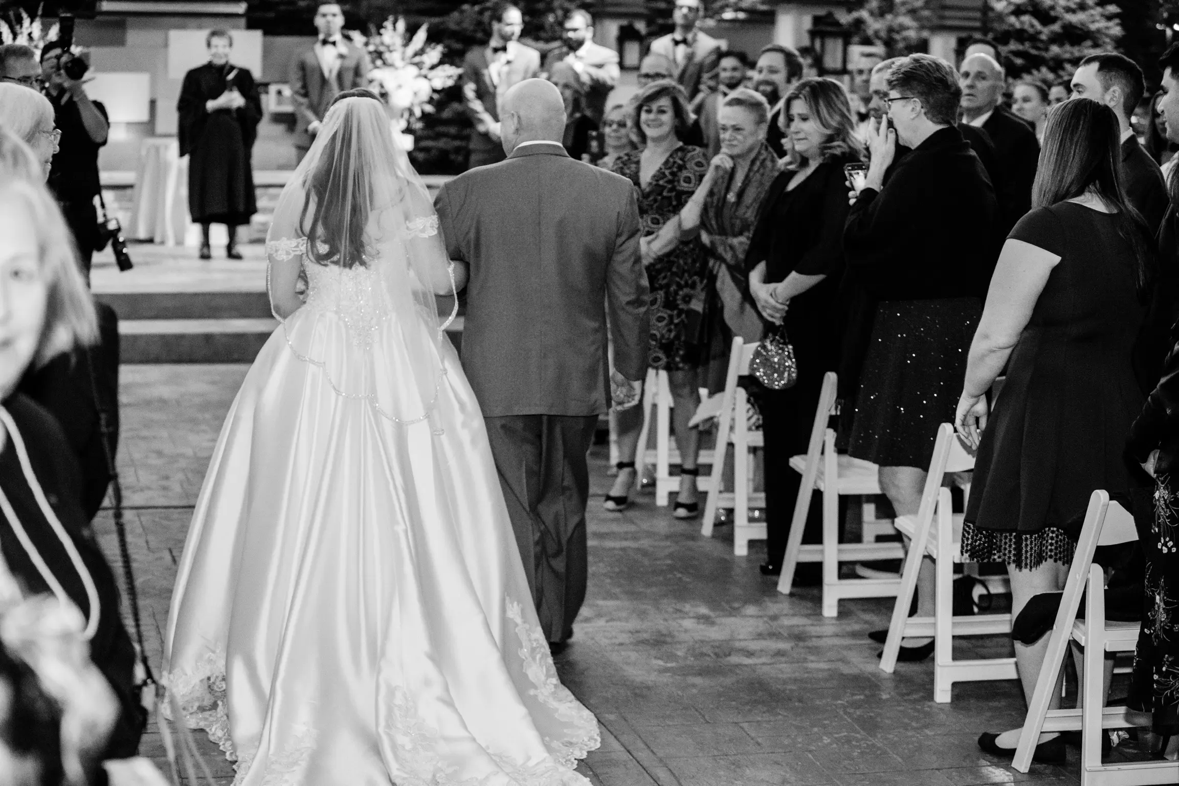 Bride And Father Walking Down Aisle. Bride Wearing Princess Ball Gown Called Kimora By Sottero And Midgley