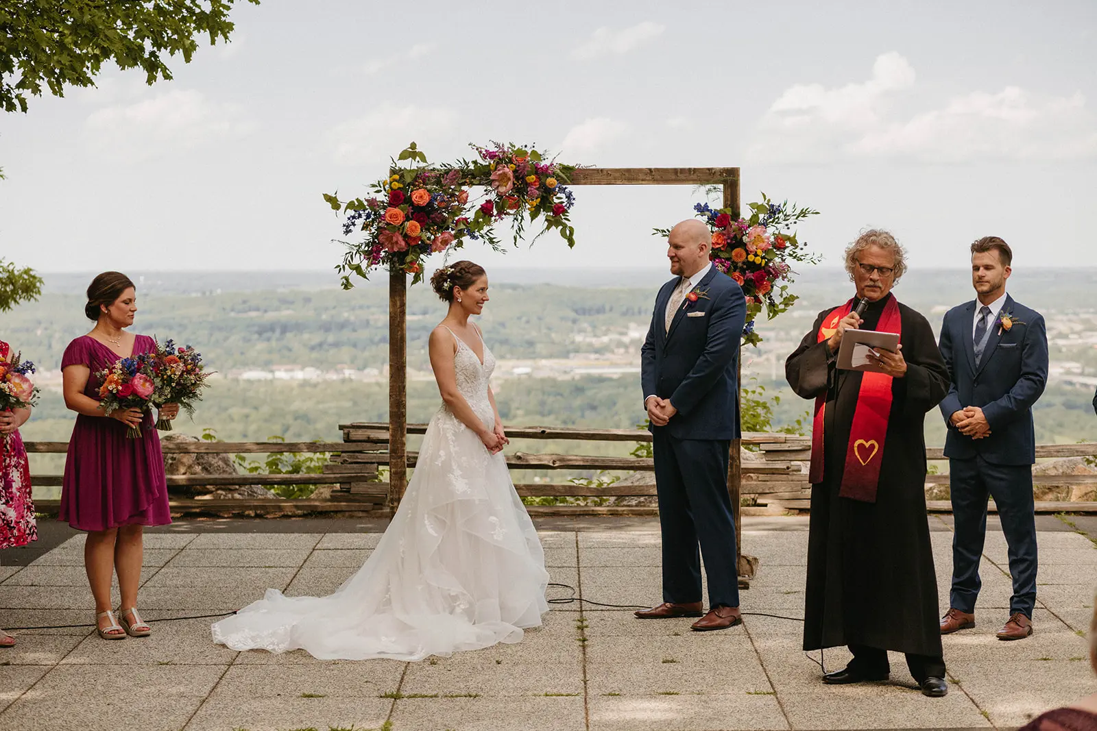 Bride In Floral Lace Bridal Gown Named Lettie By Rebecca Ingram Bride And Groom At Ceremony
