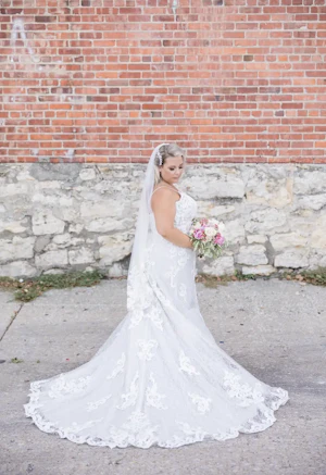 Bride wearing wedding dress called Tuscany Lane.