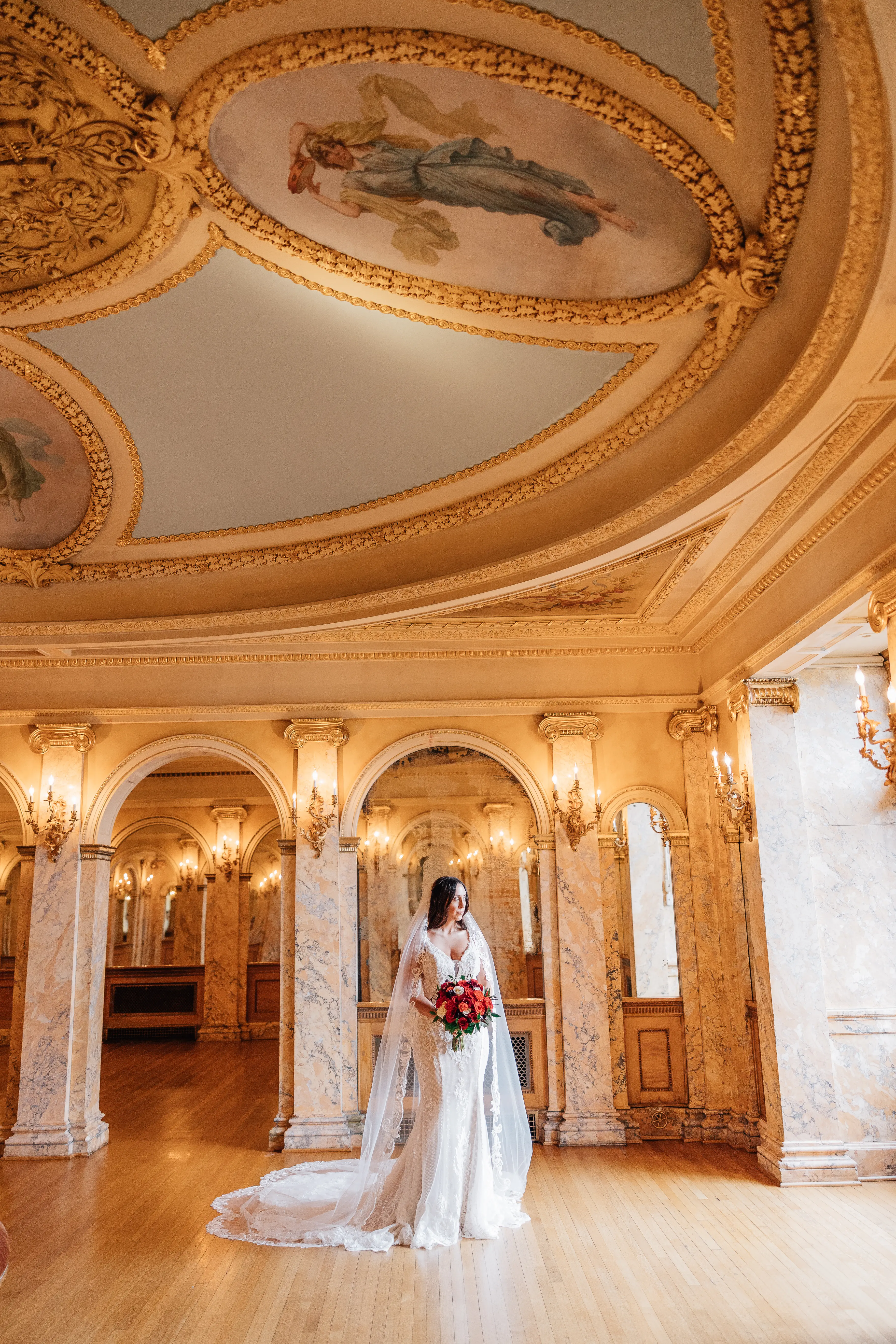 Real Bride Wearing A Vintage White Wedding Dress Named Veronique by Maggie Sottero With Veil And Red Roses