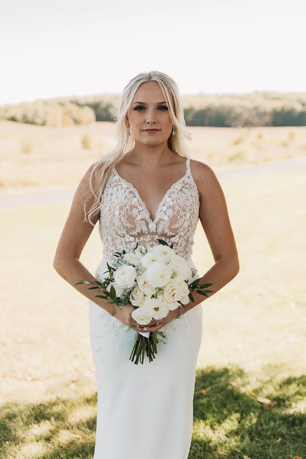 Bride wearing wedding dress called Carmen.