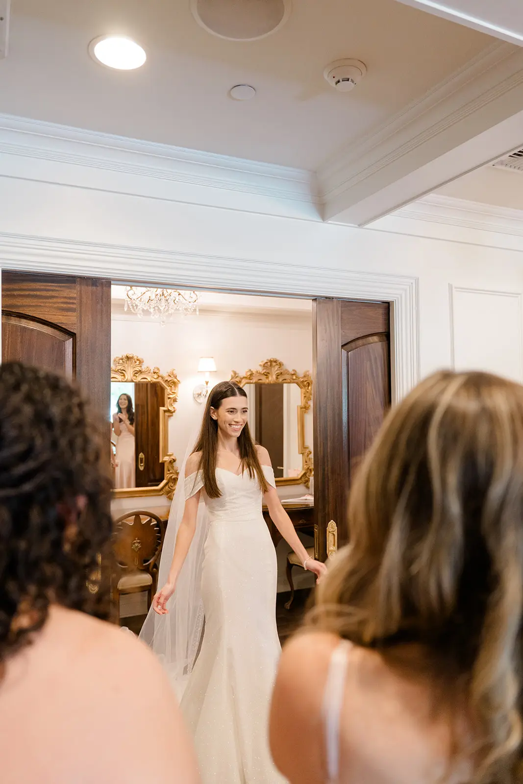 Bride wearing Anniston Lane by Maggie Sottero doing a first look with her bridesmaids