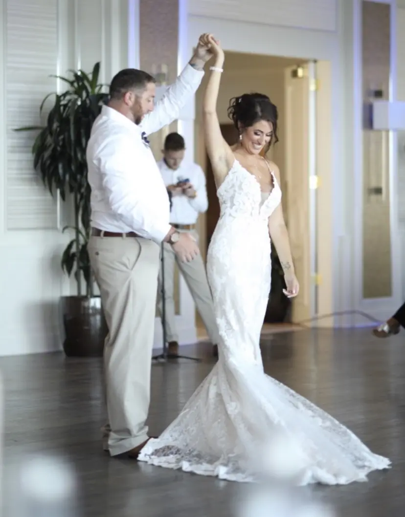 Groom With Bride Wearing Lace Sheath Wedding Dress Tuscany Lynette By Maggie Sottero