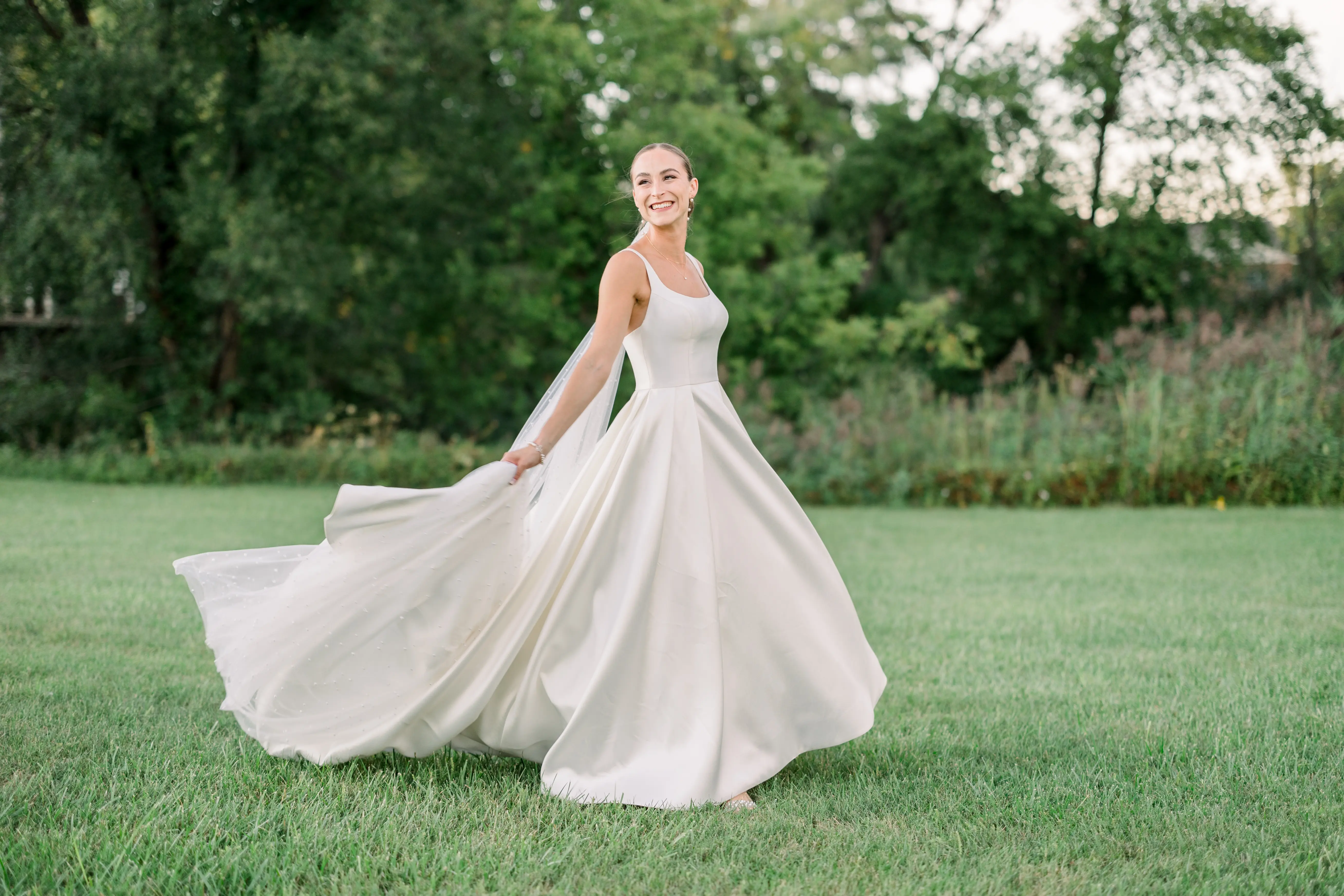 Bride Wearing Classic A-Line Wedding Dress Called Selena By Maggie Sottero Twirling Her Skirt