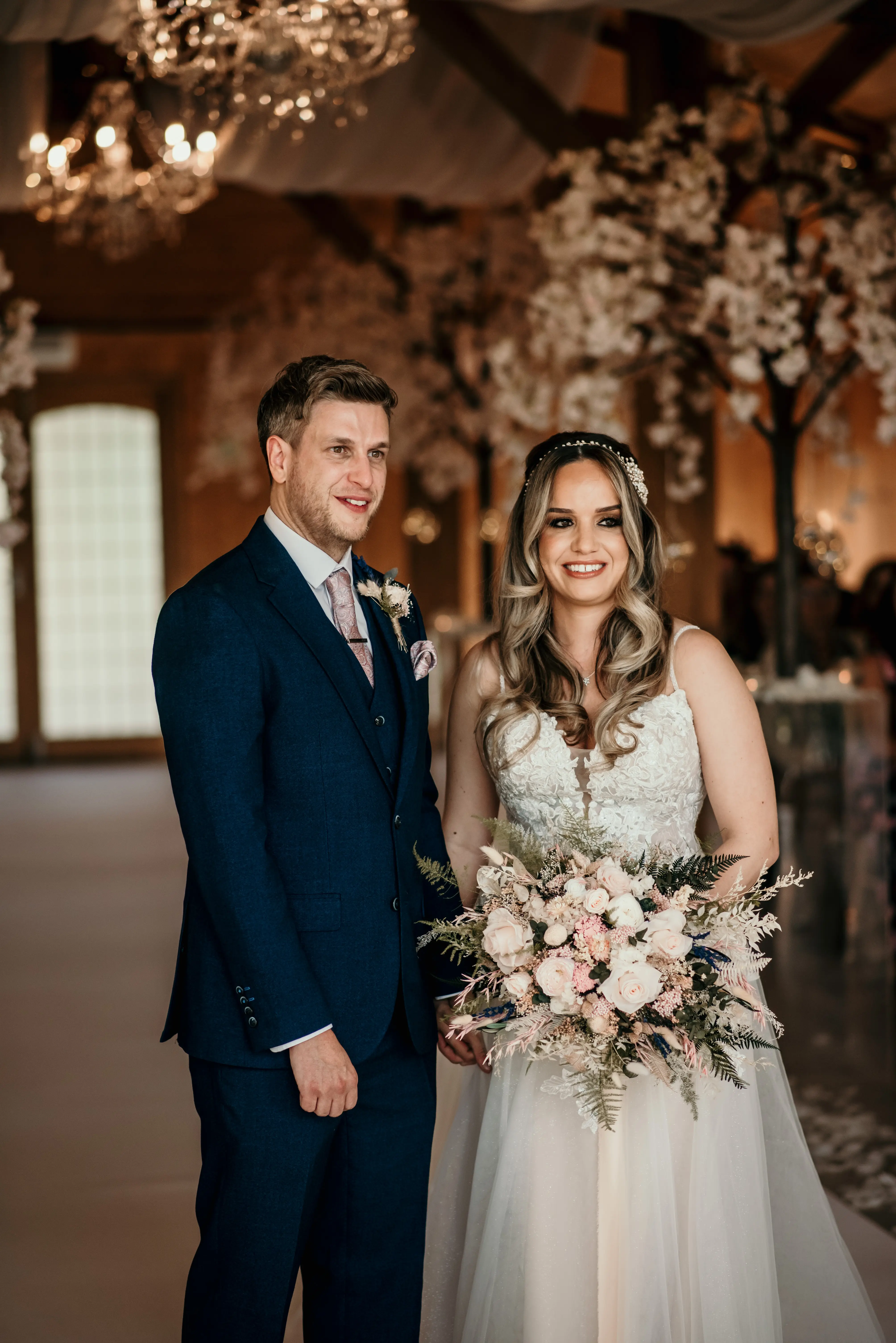 Bride wearing Stevie wedding gown by Maggie Sottero with her husband