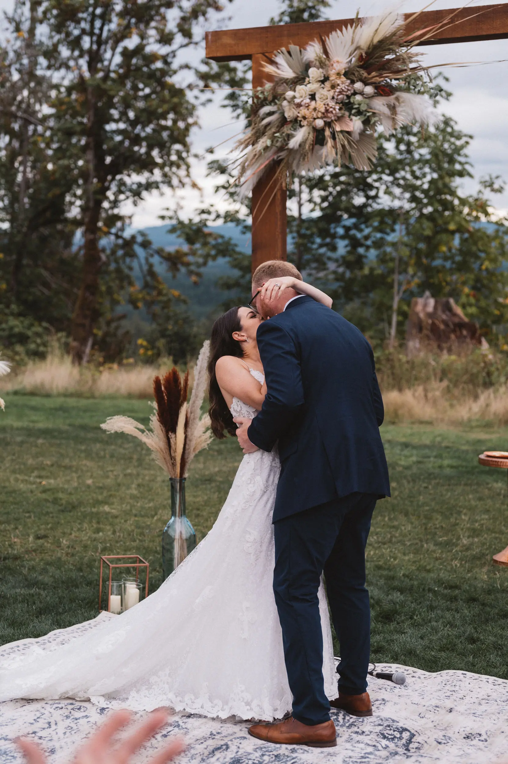Bride Wearing Lace A-Line Wedding Dress Called Tuscany Lane By Maggie Sottero Kissing the Groom