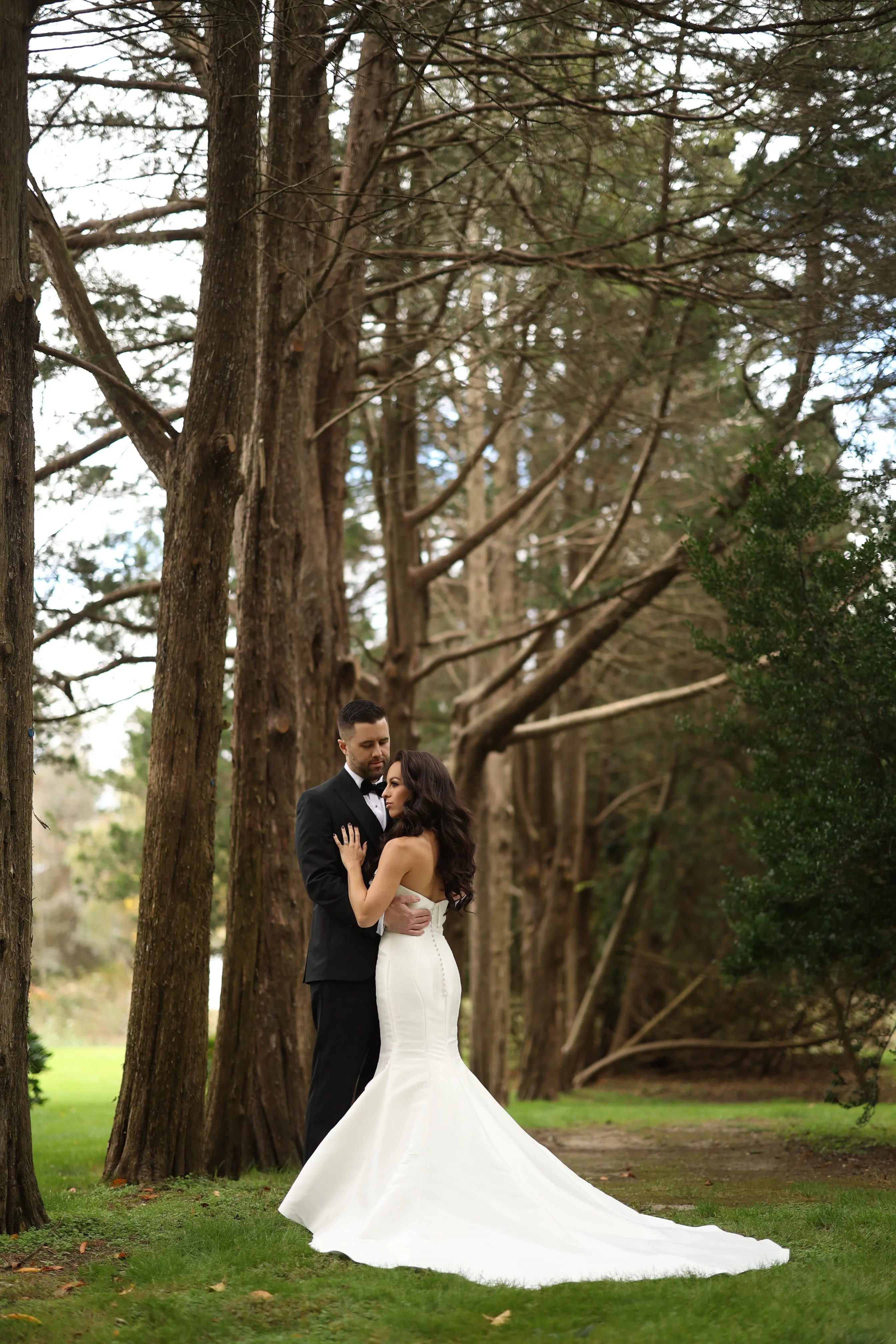 Bride wearing Mitchell Marie by Maggie Sottero with her husband