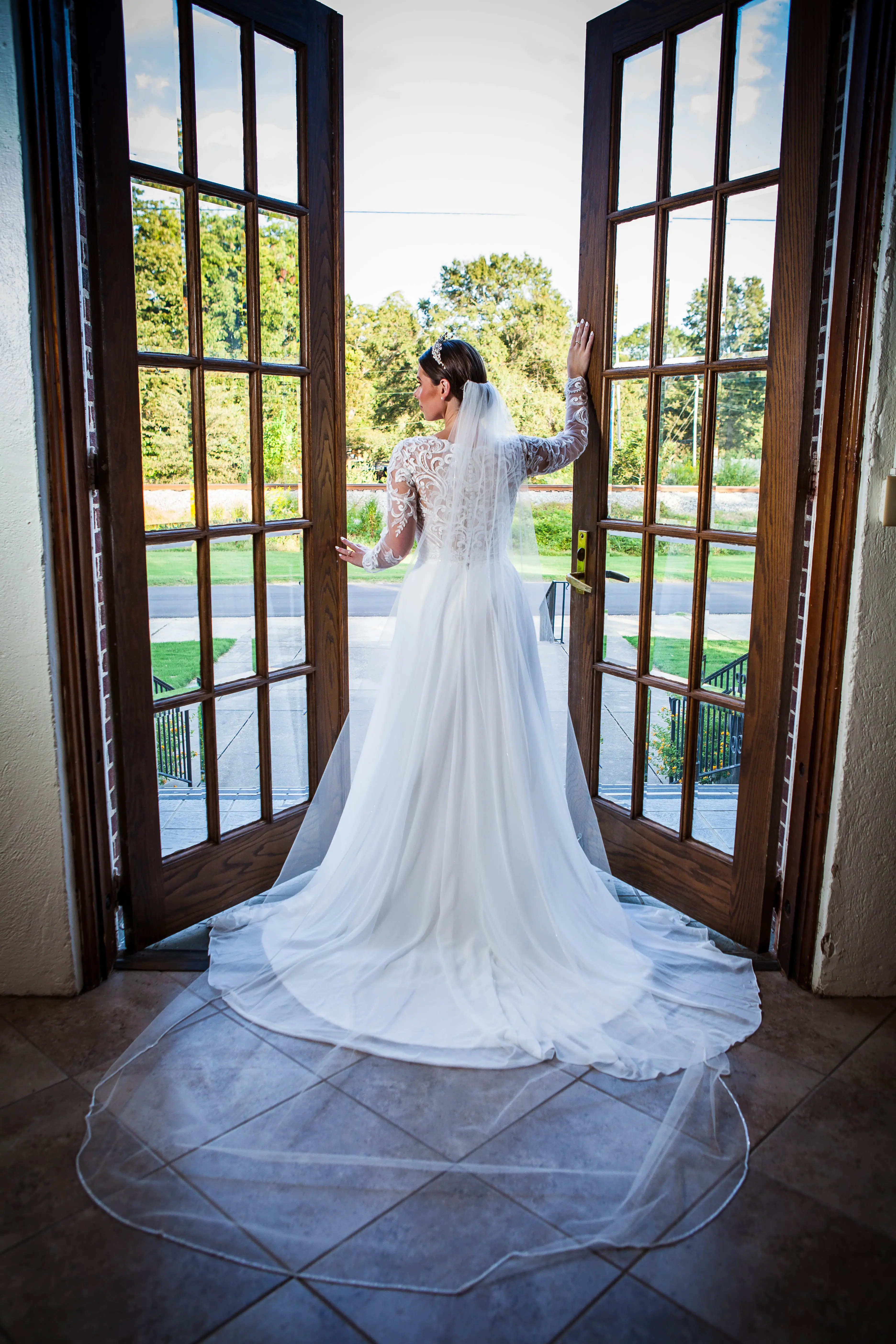 Bride wearing Lorraine Dawn wedding dress by Rebecca Ingram