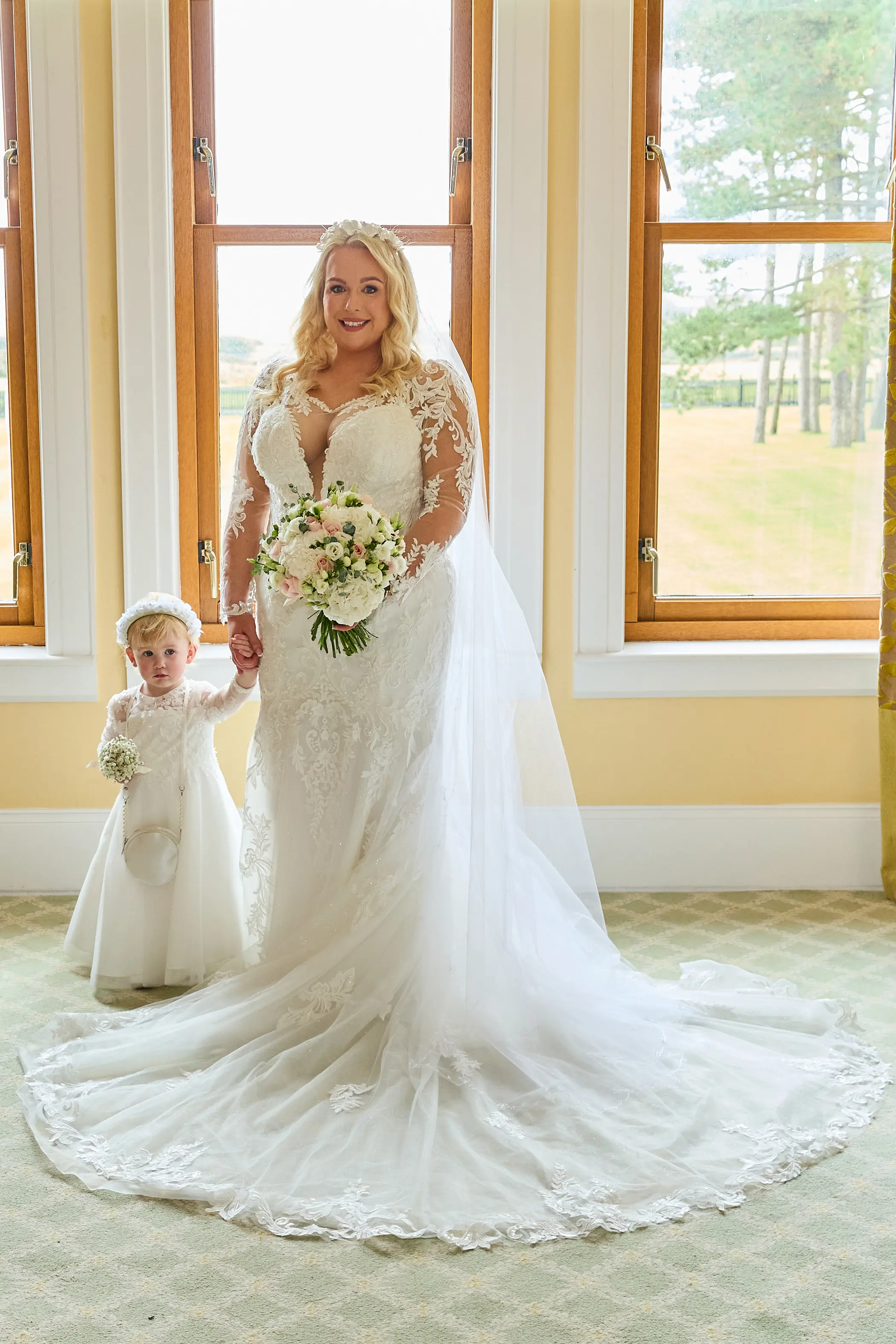 Bride wearing Saige by Maggie Sottero with her flower girl