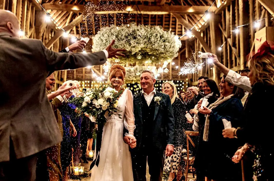 Real Bride in Bishop Sleeve A-Line Wedding Gown Called Joanne by Rebecca Ingram