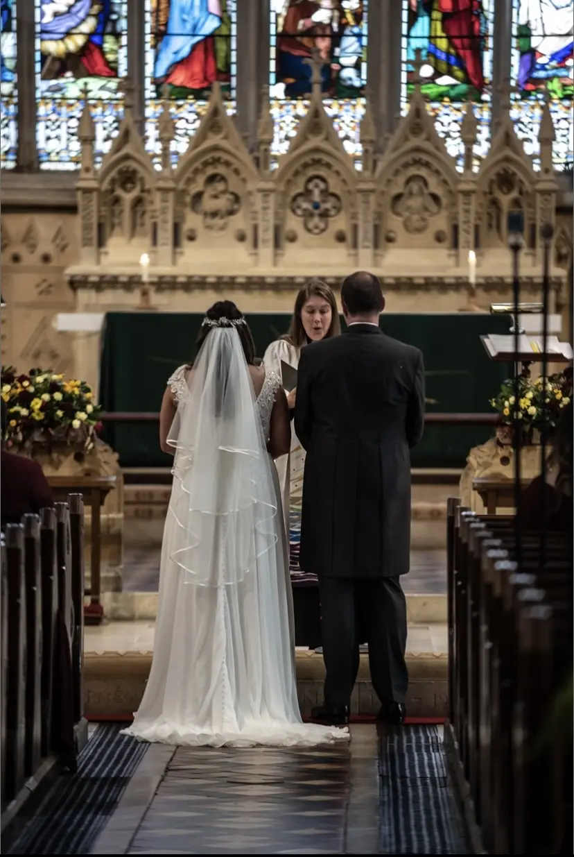 Bride Wearing Chiffon Lace Wedding Dress Called June By Maggie Sottero With Groom At The Ceremony