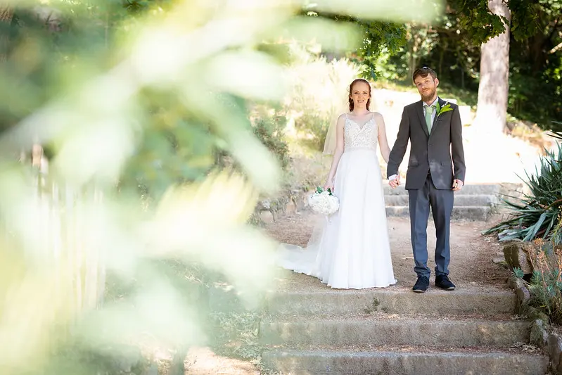 Bride Wearing Affordable Sheath Wedding Dress Called Lorraine By Rebecca Ingram With Groom