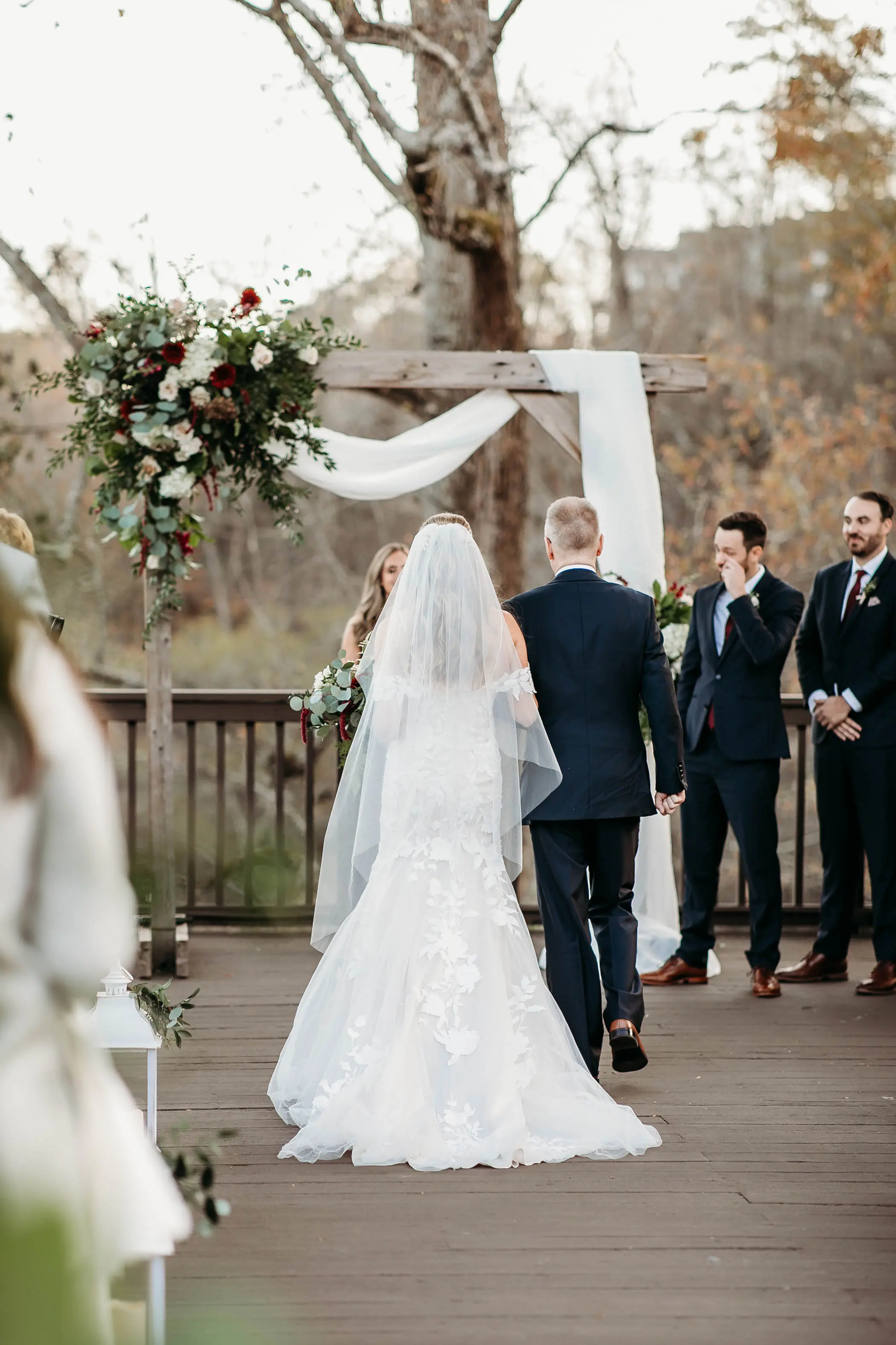 Bride Walking Down The Aisle. Bride Wearing Mermaid Wedding Dress With Oversized Lace Called Hattie By Rebecca Ingram