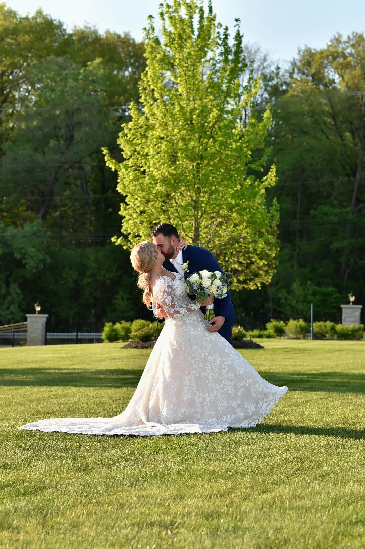 Bride Wearing Long Sleeve Floral Lace Wedding Dress Called Sawyer By Sottero and Midgley Dipped By Groom