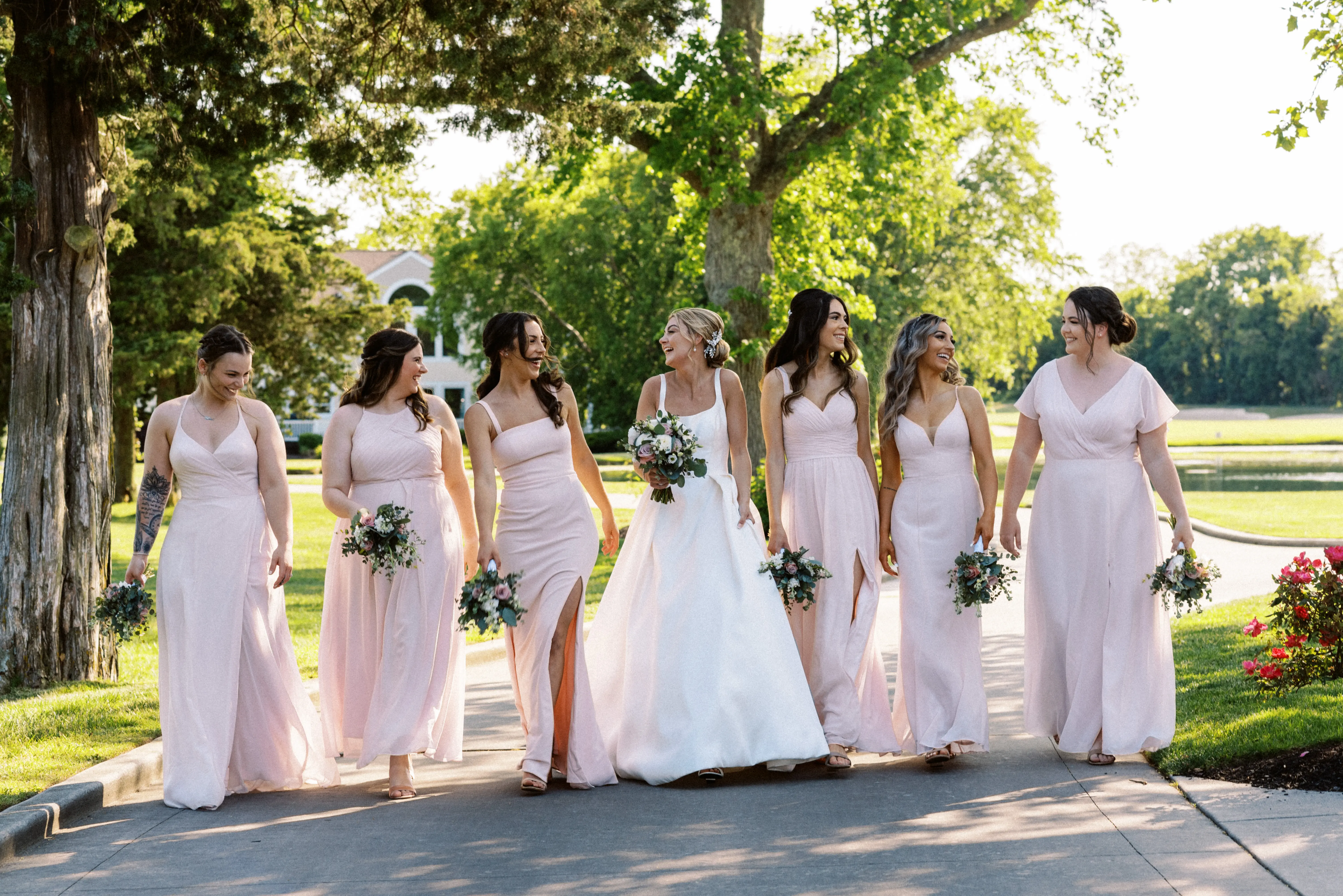 Bride wearing Selena wedding dress by Maggie Sottero with her bridesmaids