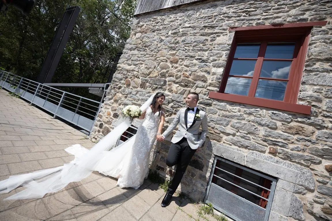 Bride Wearing Lace Sheath Wedding Dress Called Tuscany Lynette By Maggie Sottero With Groom