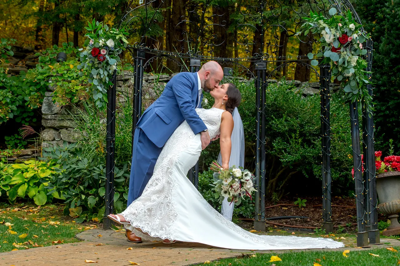 Bride wearing Lace Sheath Wedding Dress called Kevyn by Sottero and Midgley with Groom